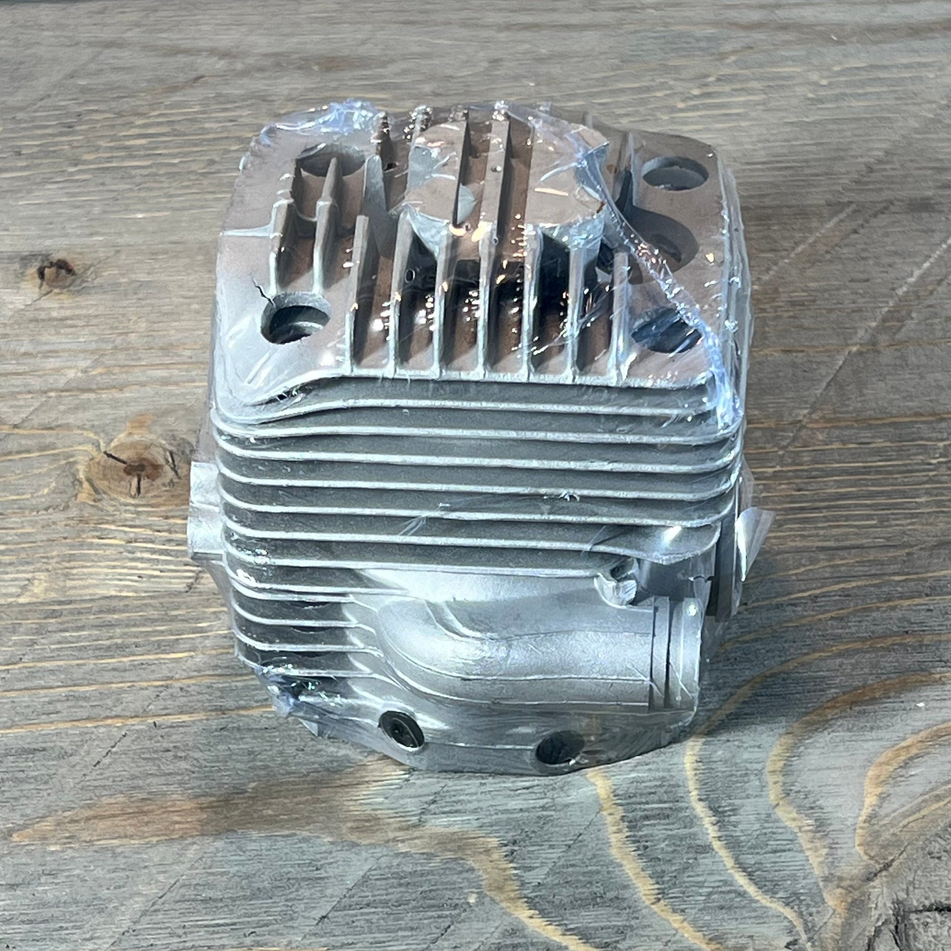 Durable 56mm cylinder piston kit for Stihl TS700 TS800 saws, showcasing top view of finely machined aluminum.