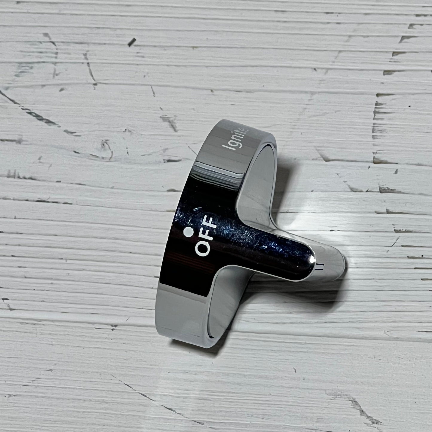Durable stainless steel gas stove knob replacement for Whirlpool, showing 'OFF' position on a textured surface.
