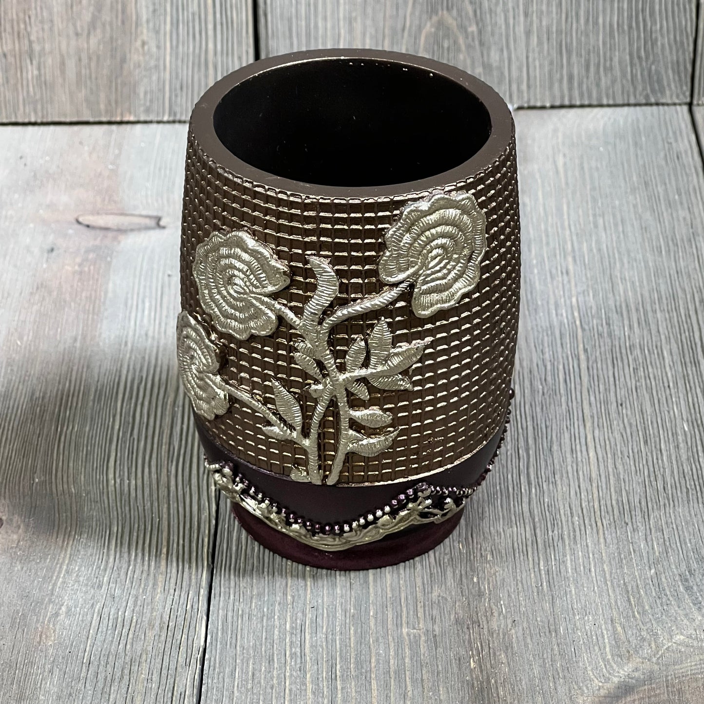 Burgundy tumbler with embossed silver rose design, Popular Bath Ombre collection, elegant bathroom accessory.