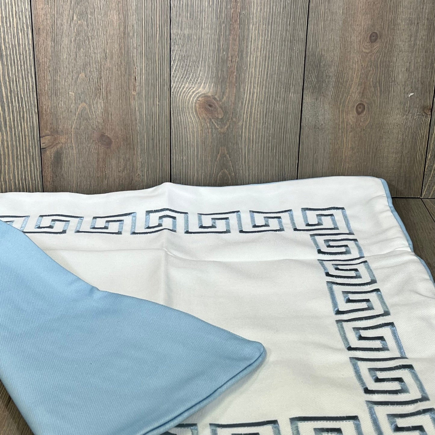 Embroidered Greek Key pillow cover in baby blue, 20"x20", water-repellent, ideal for outdoor patio decor.