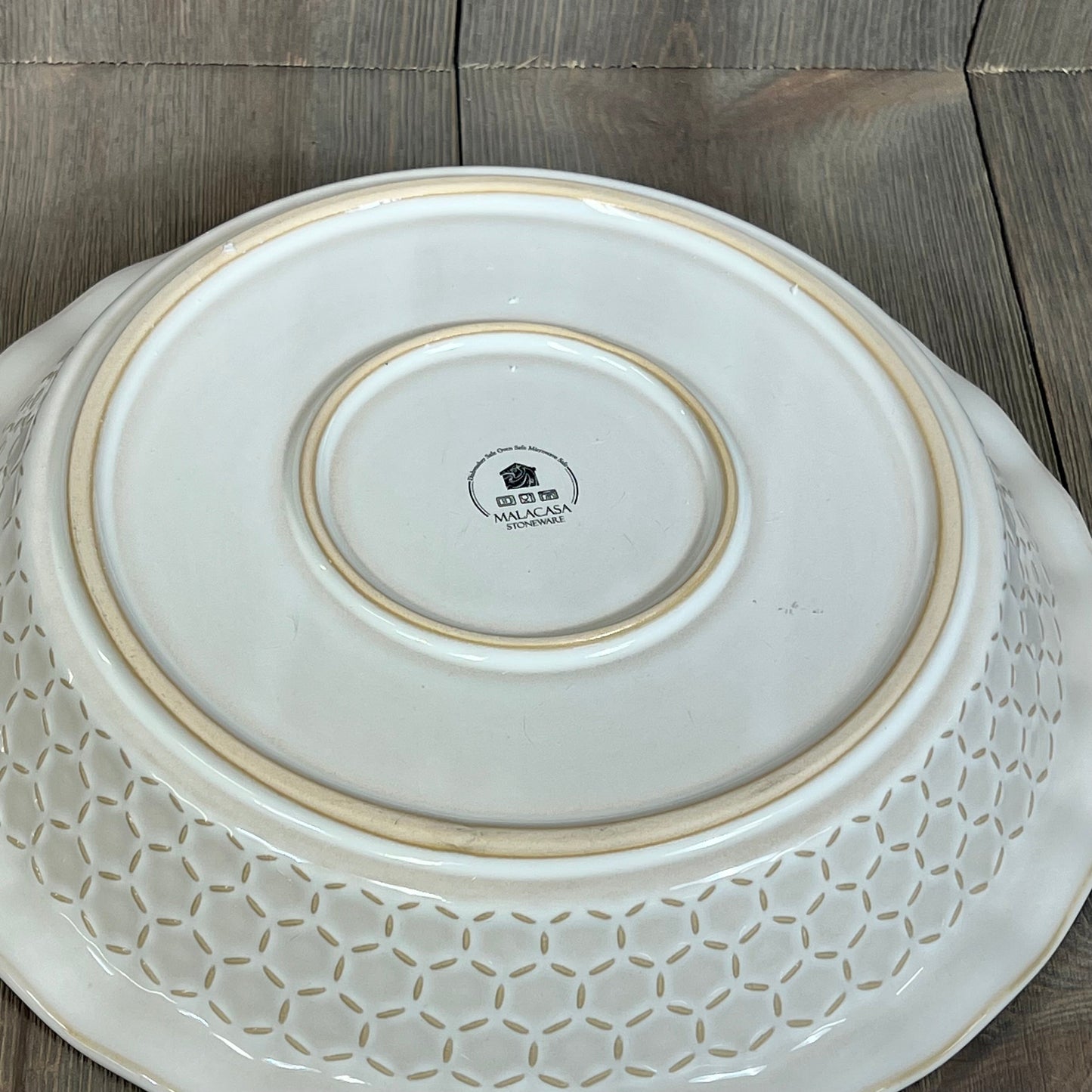 Embossed underside of MALACASA 9-inch stoneware pie dish, showcasing durable craftsmanship and elegant design.