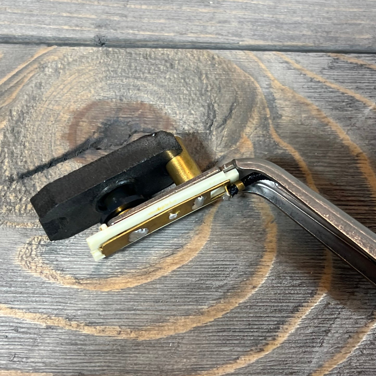 Engine oil level sensor for Lexus GS430 and LS430, part 89491-50030, shown on rustic wooden background.