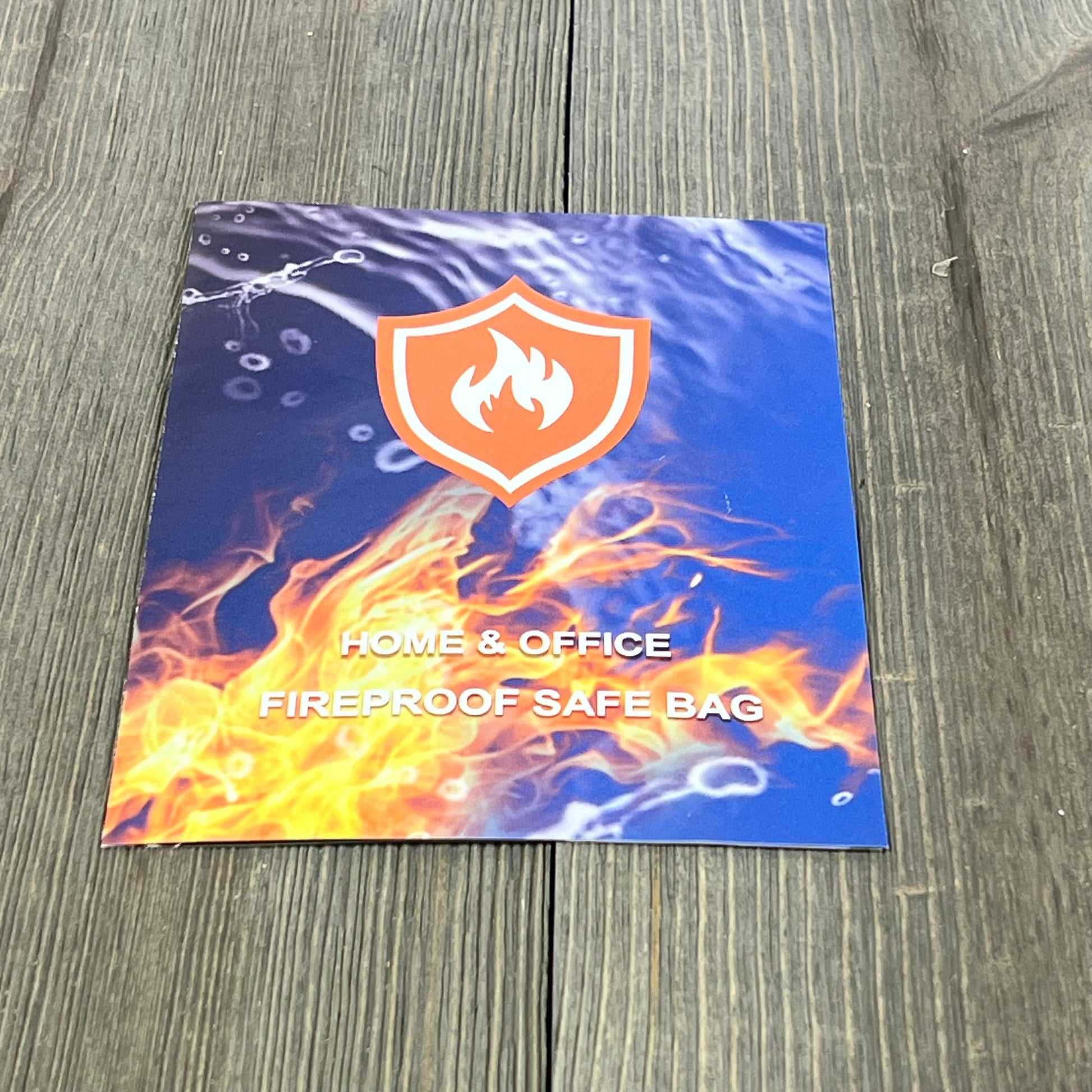 Fireproof document money bag brochure on wood, showcasing fire and water resistance features for home and office safety.