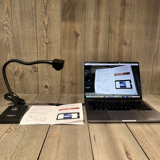 USB document camera setup for teachers, showing webcam focused on documents for remote teaching and web conferencing.