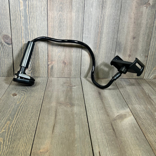 Flexible gooseneck tablet stand holder with clip, compatible with iPad, iPhone, and more, on a wooden background.