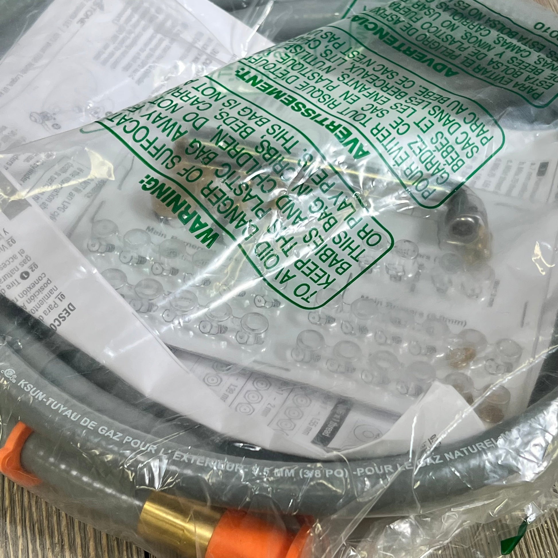 Gray Blackstone 5249 conversion kit in packaging with propane hose and fittings for natural gas setup.