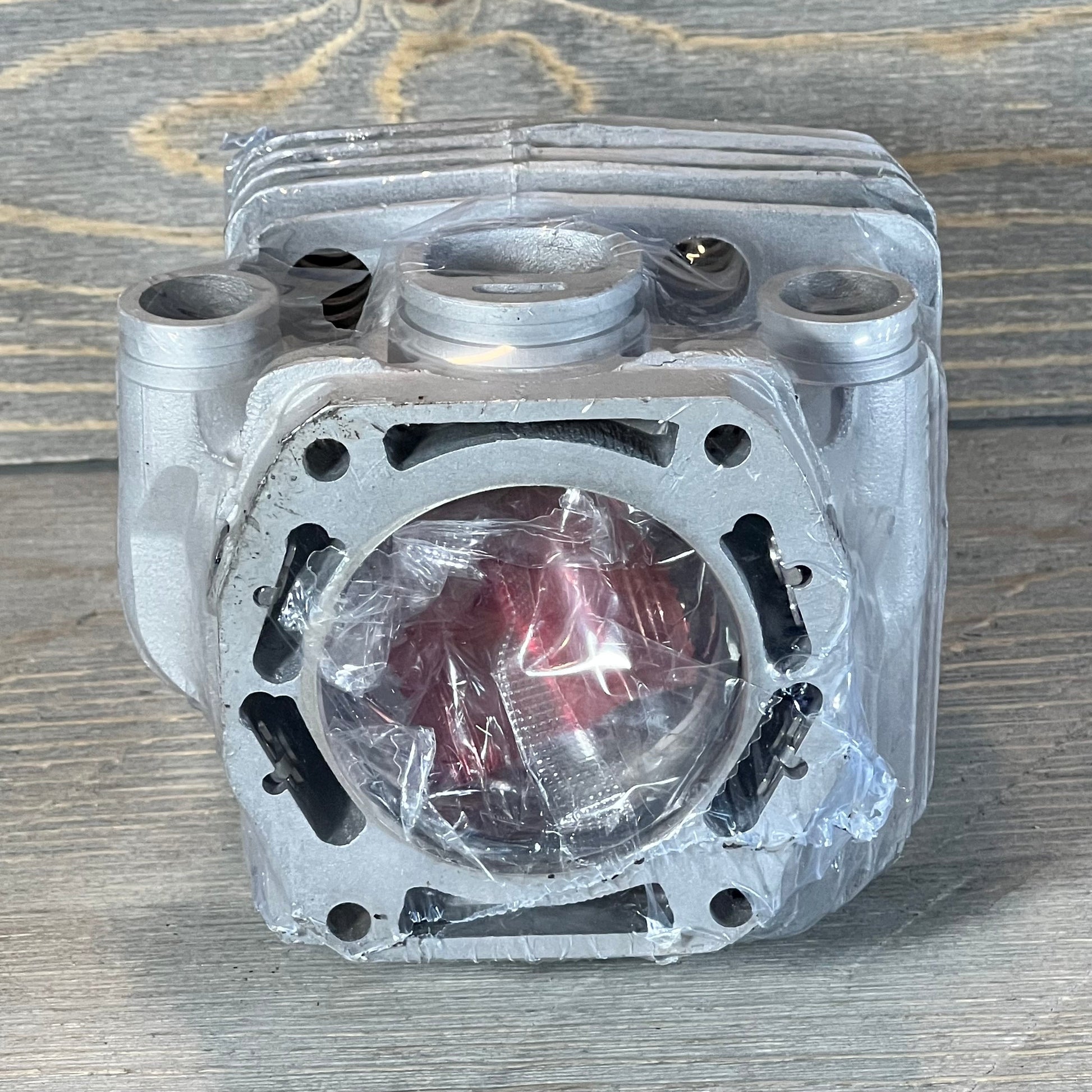 Front view of Yingspart 56mm Cylinder Piston Kit for Stihl TS700 TS800, showcasing wrapped components.