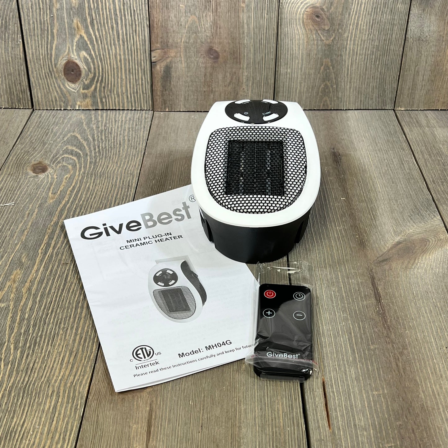 GiveBest programmable space heater with LED display and remote on wooden surface, includes instruction manual.