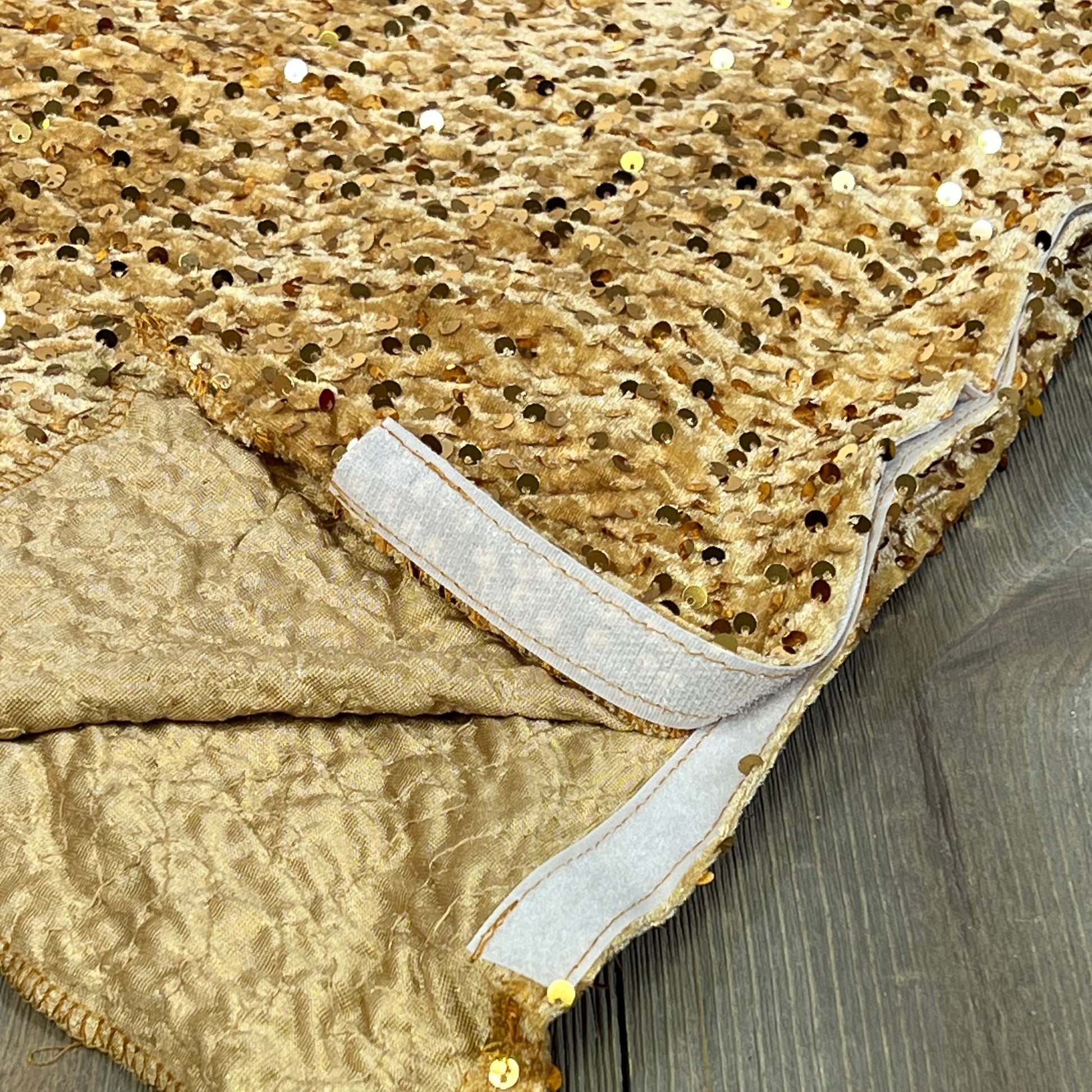 Golden sequin velvet Christmas tree skirt for pencil tree, showcasing intricate detail and luxurious texture.