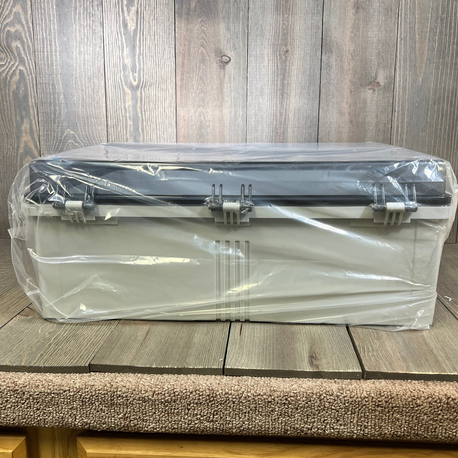 Waterproof junction box with clear hinged cover, showcasing sturdy design for outdoor electrical projects.