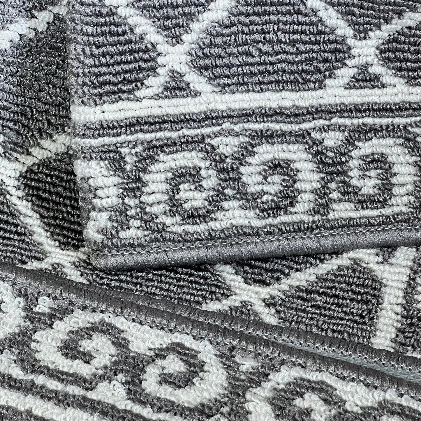 Gray and white geometric pattern on HEBE indoor door mat, 32"x48", non-slip and washable for entryways and hallways.