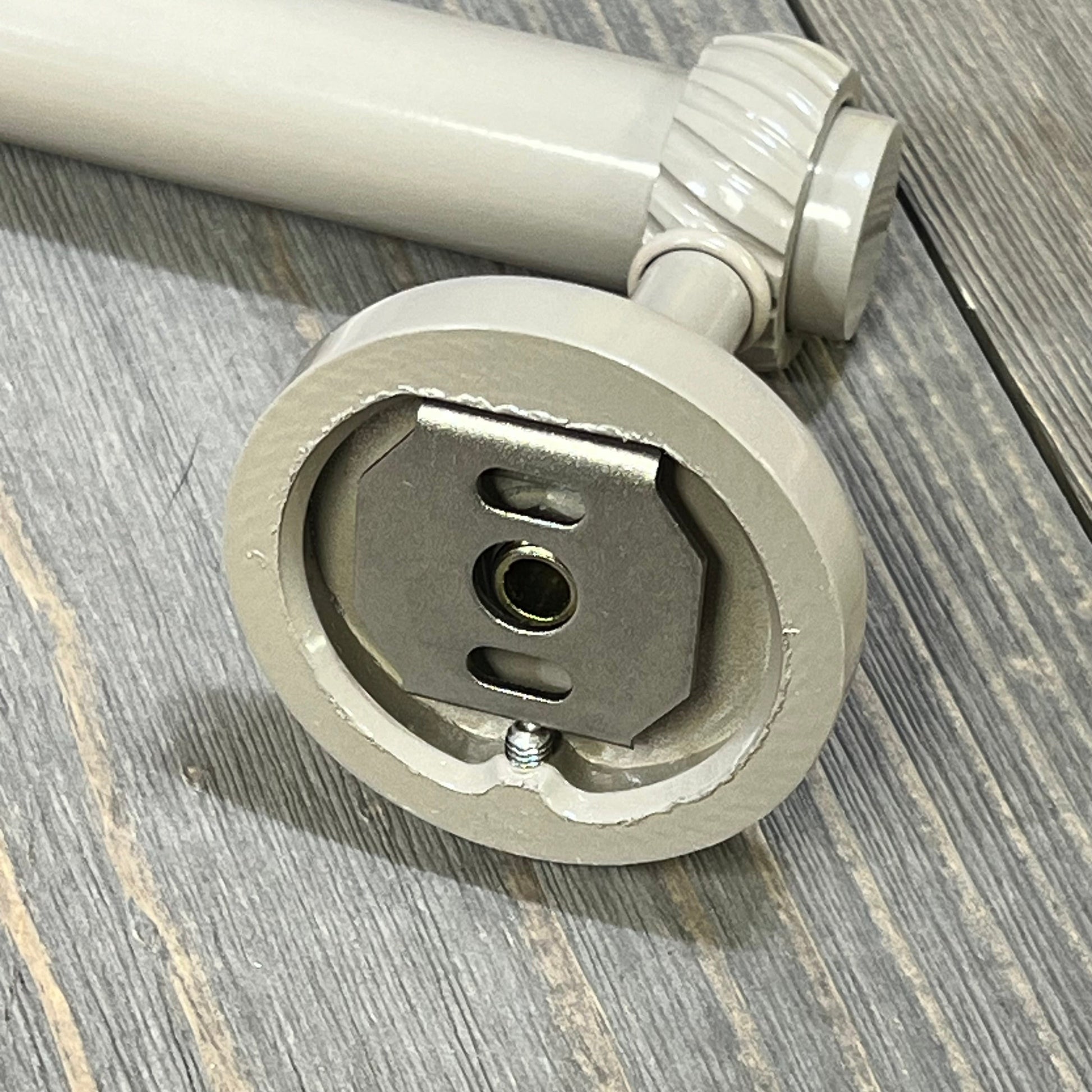 Shaded beige Allied Brass towel bar close-up showing twist detail and mounting bracket, part of Satellite Orbit Two Collection.