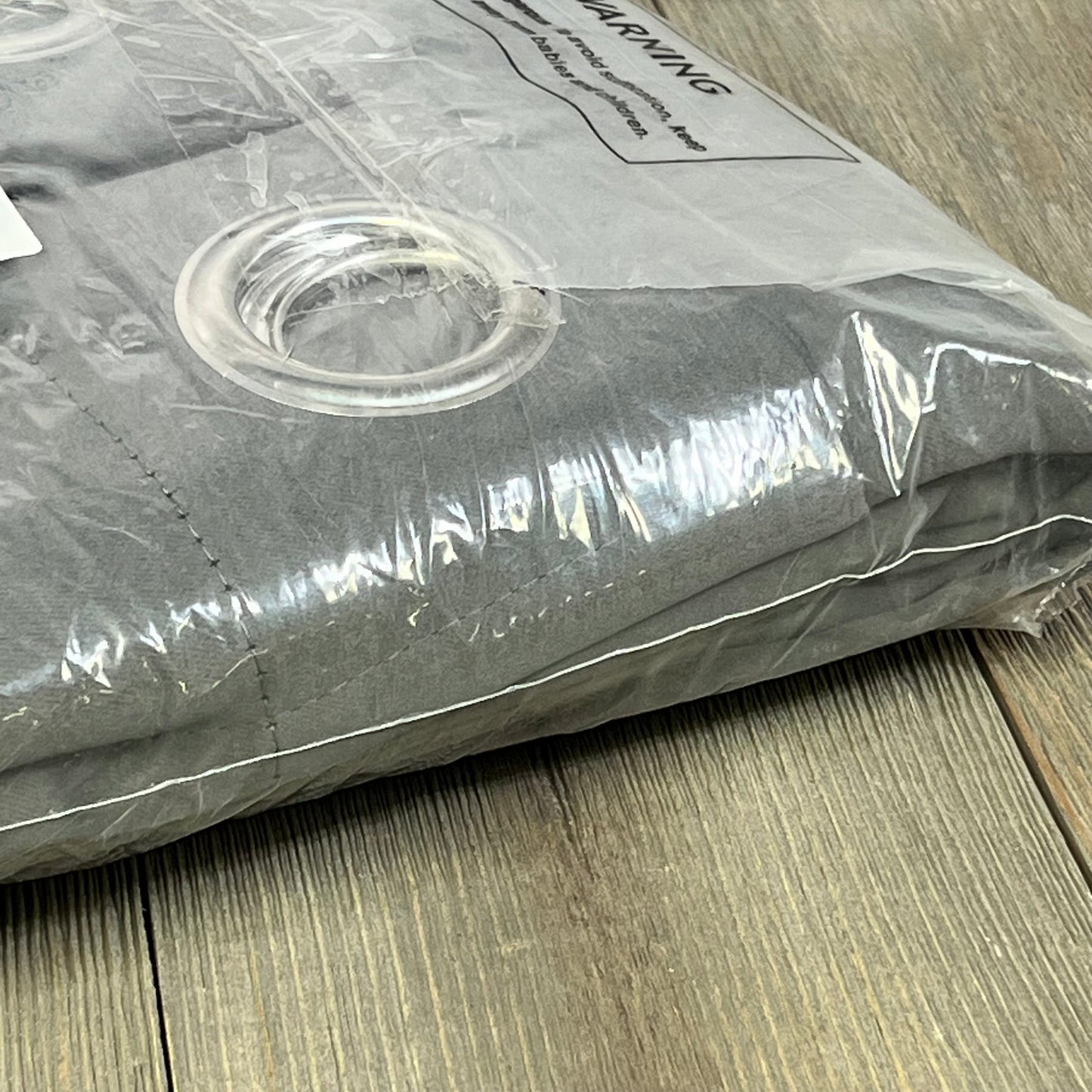 Joydeco extra long dark grey blackout curtains in packaging, featuring grommet tops for easy installation, 108 inches long.