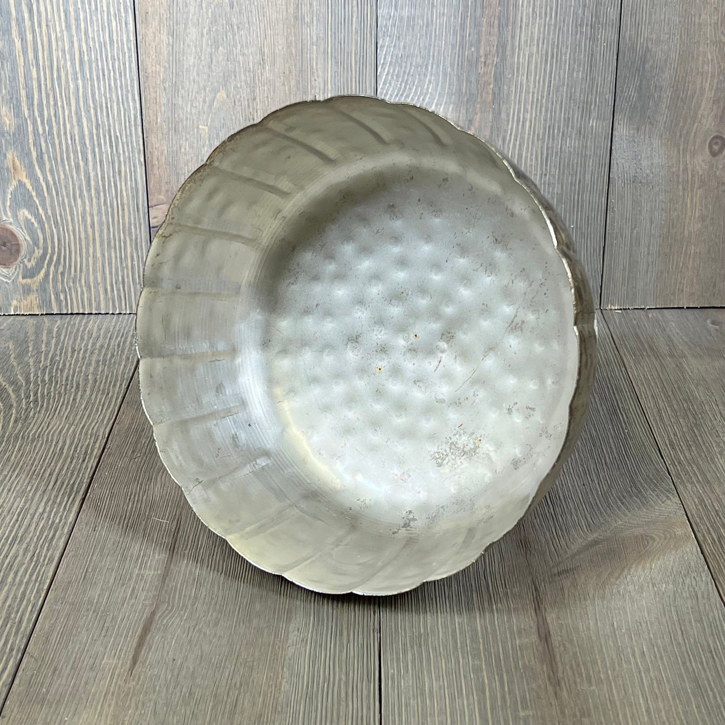 Distressed champagne metal compote bowl with a textured finish, perfect for indoor and outdoor event decor.