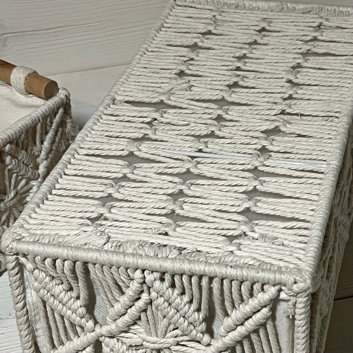 Handwoven ivory white macrame storage baskets in bohemian style, ideal for bathroom and bedroom organization.