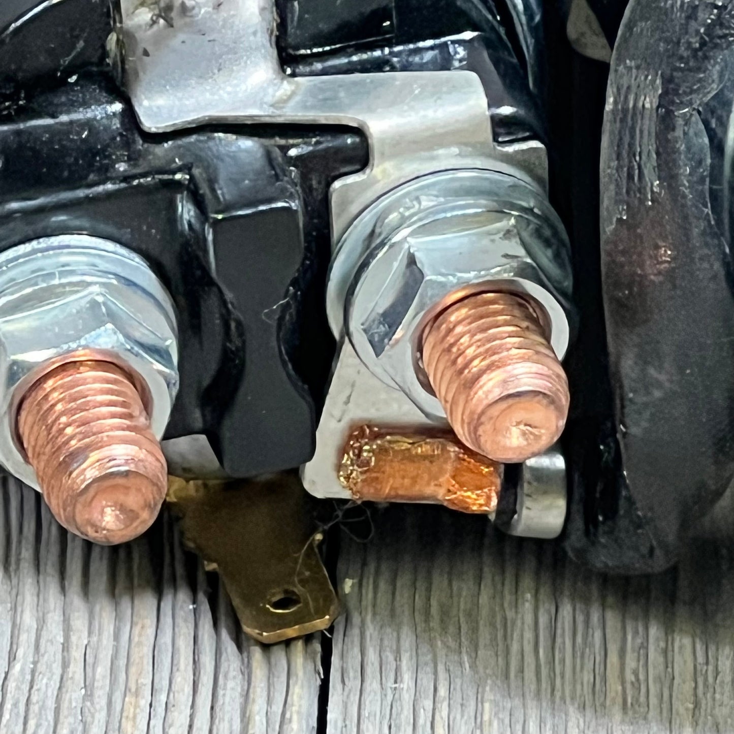 Close-up of OCPTY Starter terminal connections for Grand Cherokee 4.0L L6, showcasing copper and metal components.