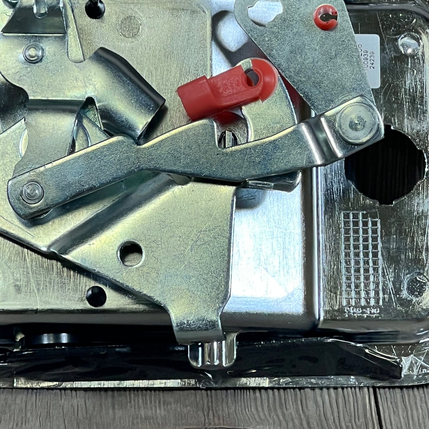 Chrome exterior door handle for Freightliner, featuring robust metal construction and white hardware, close-up view.