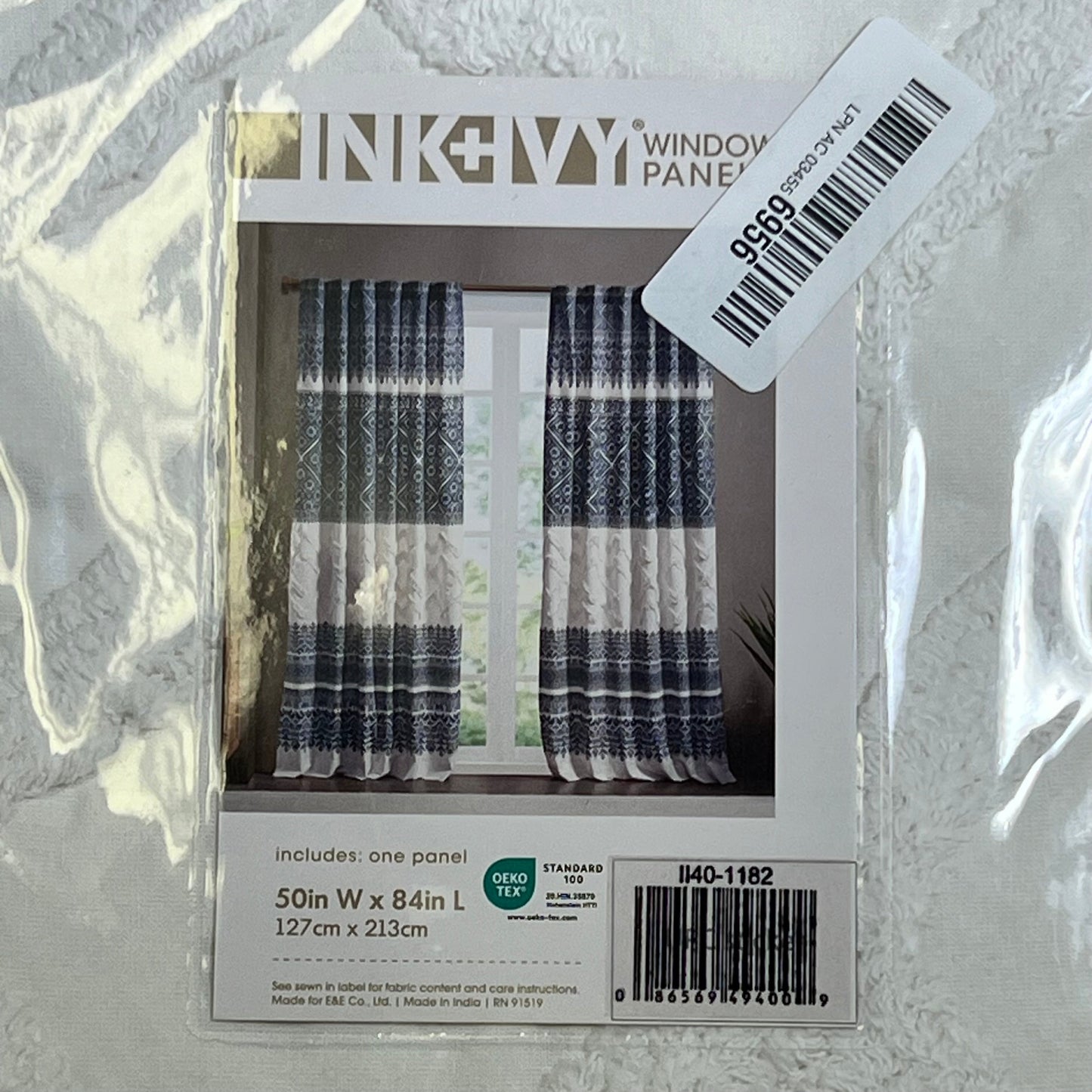 Boho navy and white curtain panel by INK+IVY, featuring tufted chenille design, perfect for living room or bedroom window decor.