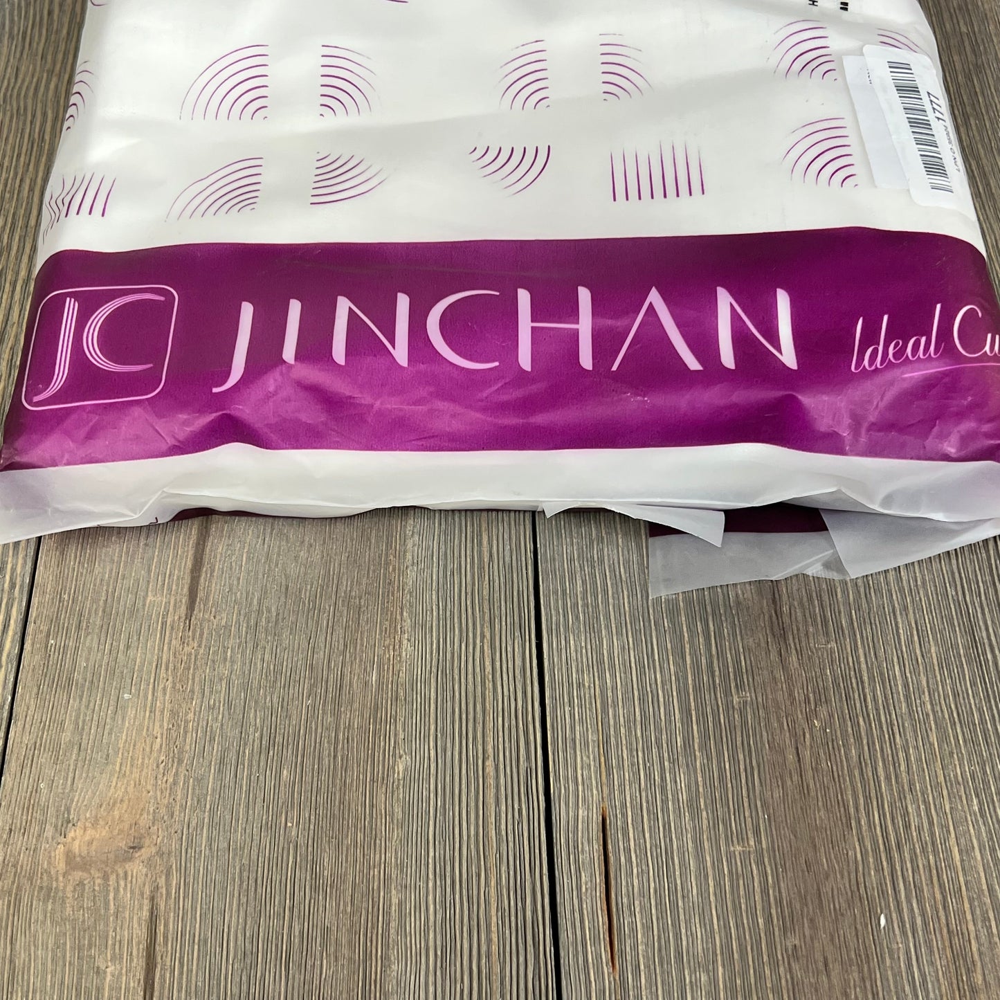 Jinchan white linen blend curtains packaged on rustic wooden surface, ideal for farmhouse-style living rooms and bedrooms.