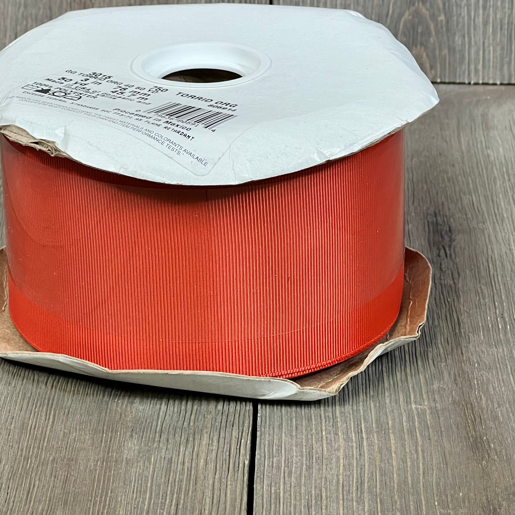 Large spool of Berwick Offray 3" grosgrain ribbon in vibrant Torrid Orange, 50 yards, ideal for crafts and decor.