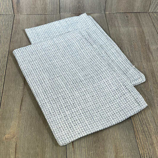 Blue grey linen pillow covers on wooden surface, perfect for farmhouse decor. Set of 2, 16x24 inch lumbar cushion cases.