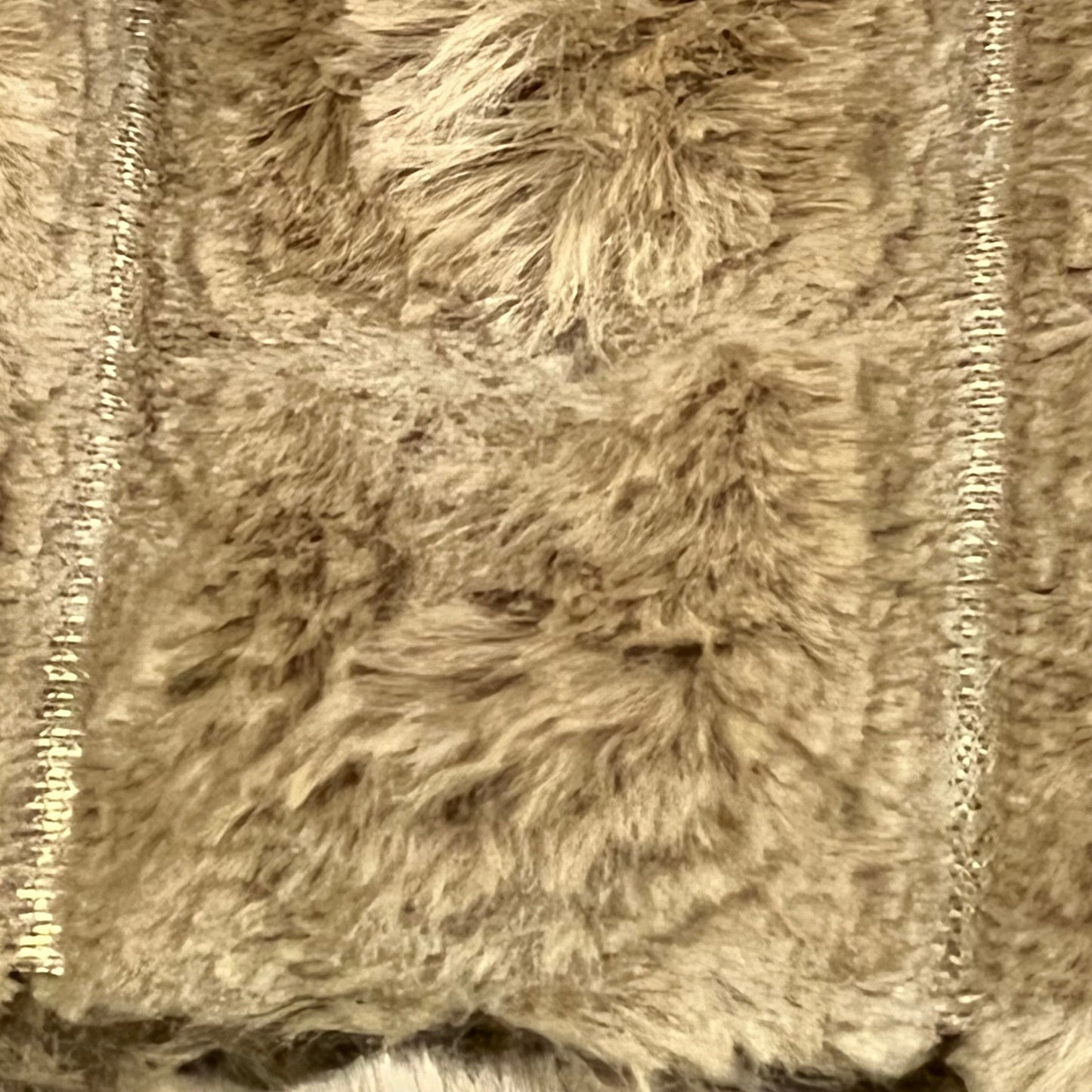 Brown faux fur pillow cover with luxurious plaid texture, perfect for enhancing sofa or bed decor in living rooms.