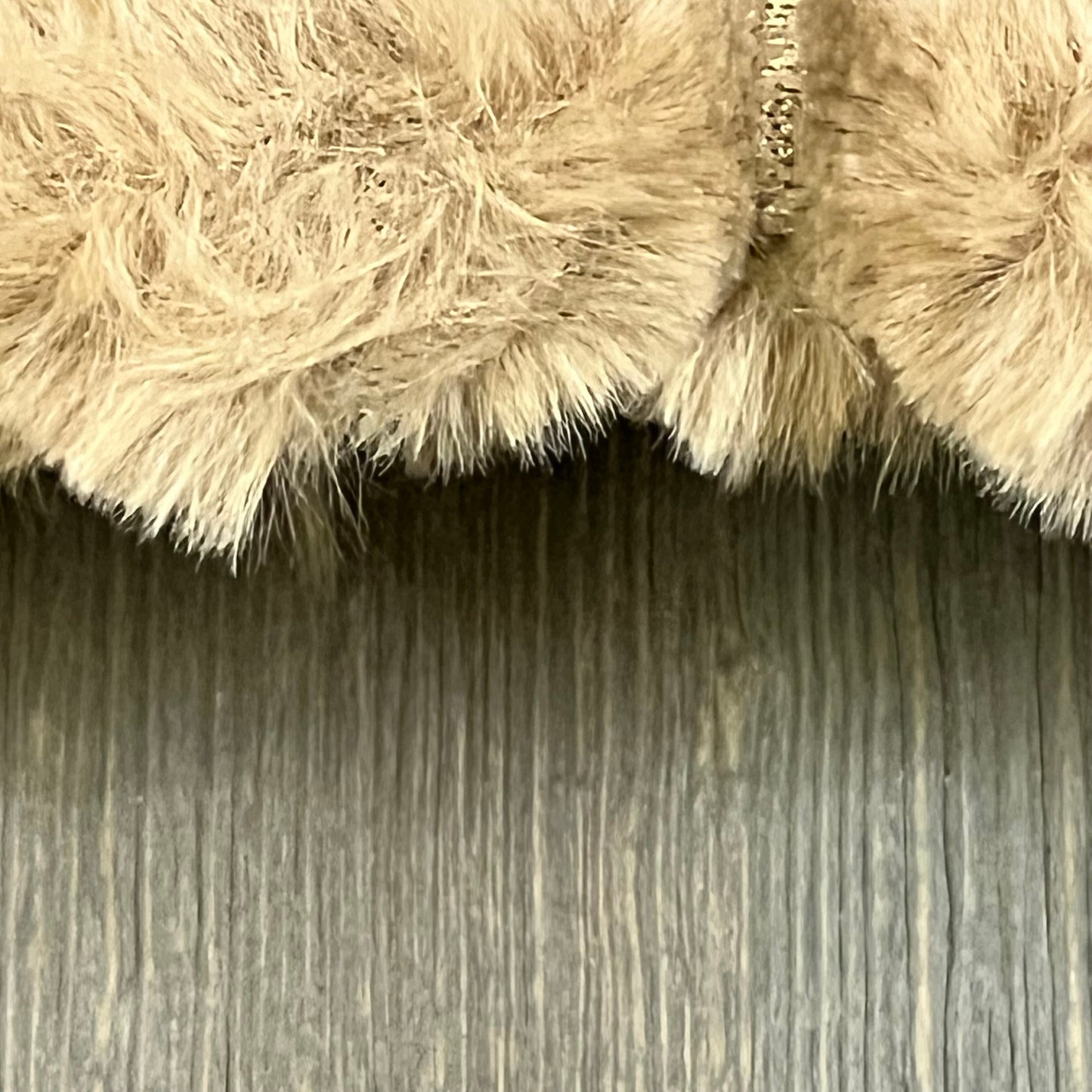 Close-up of brown faux fur texture on MANDIOO luxury throw pillow cover, highlighting softness and plaid design.