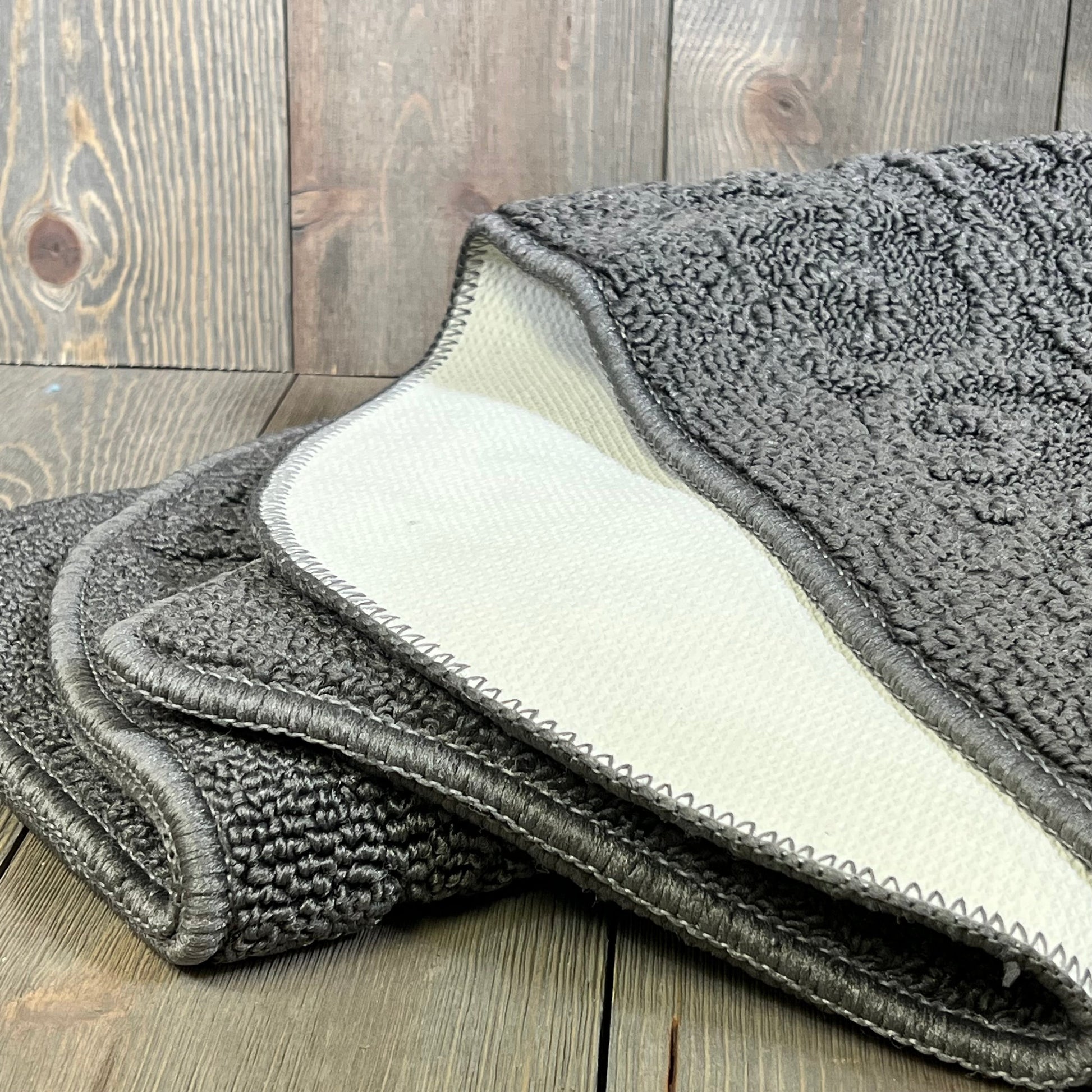 Grey anti-fatigue kitchen rug with non-slip backing, showcasing durable polypropylene texture for comfort and safety.