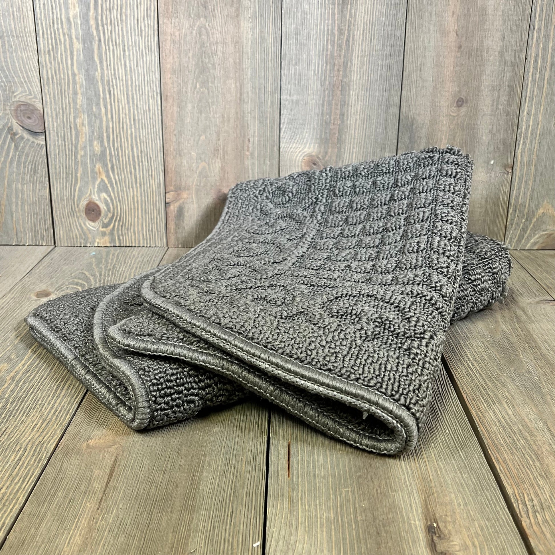 Gray half-round anti-fatigue kitchen rug, 32x20 inches, made of 100% polypropylene, perfect for comfort and non-slip use.