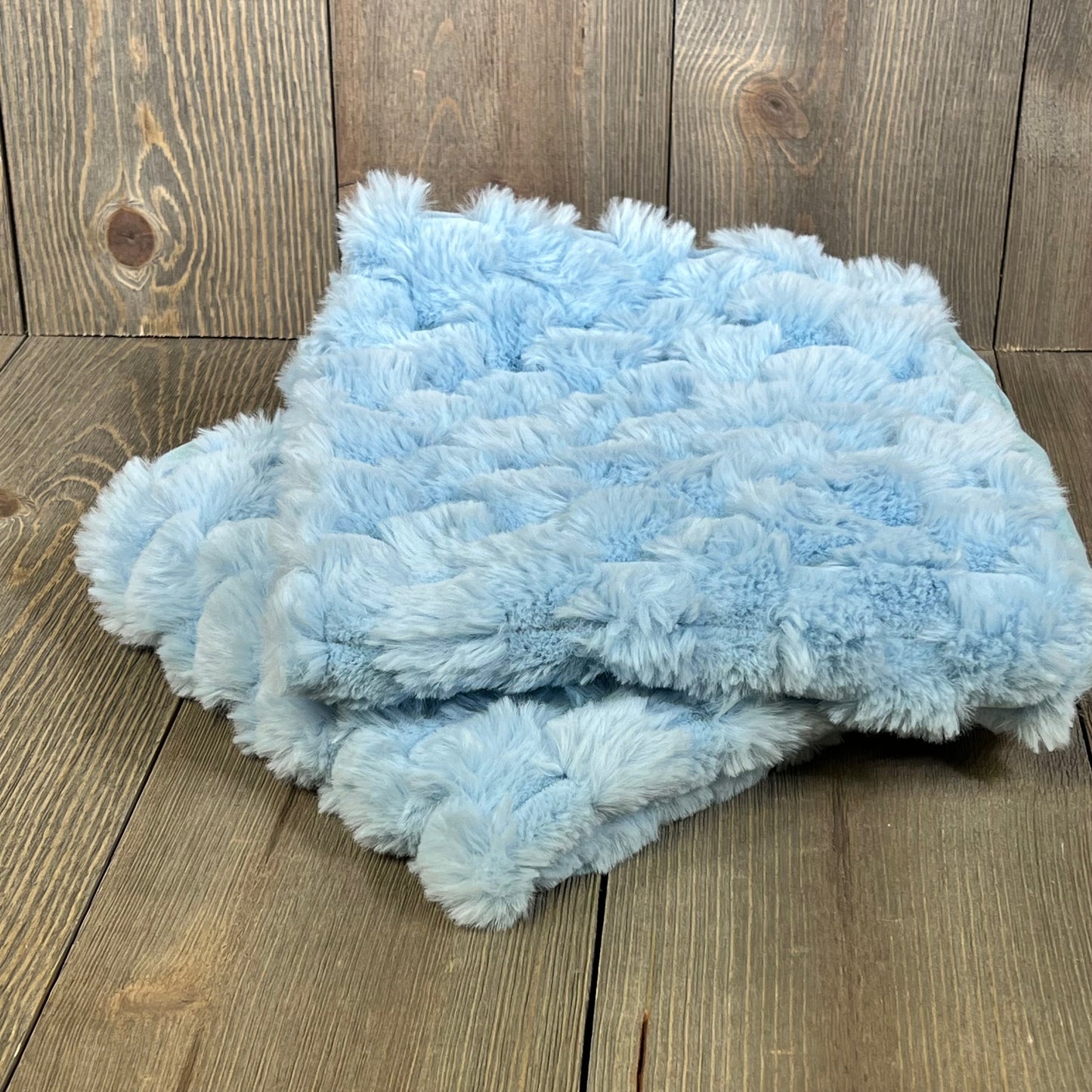 Light blue plush fluffy throw pillow covers on wooden background, perfect for sofa or bed decor, 18x18 inch size.