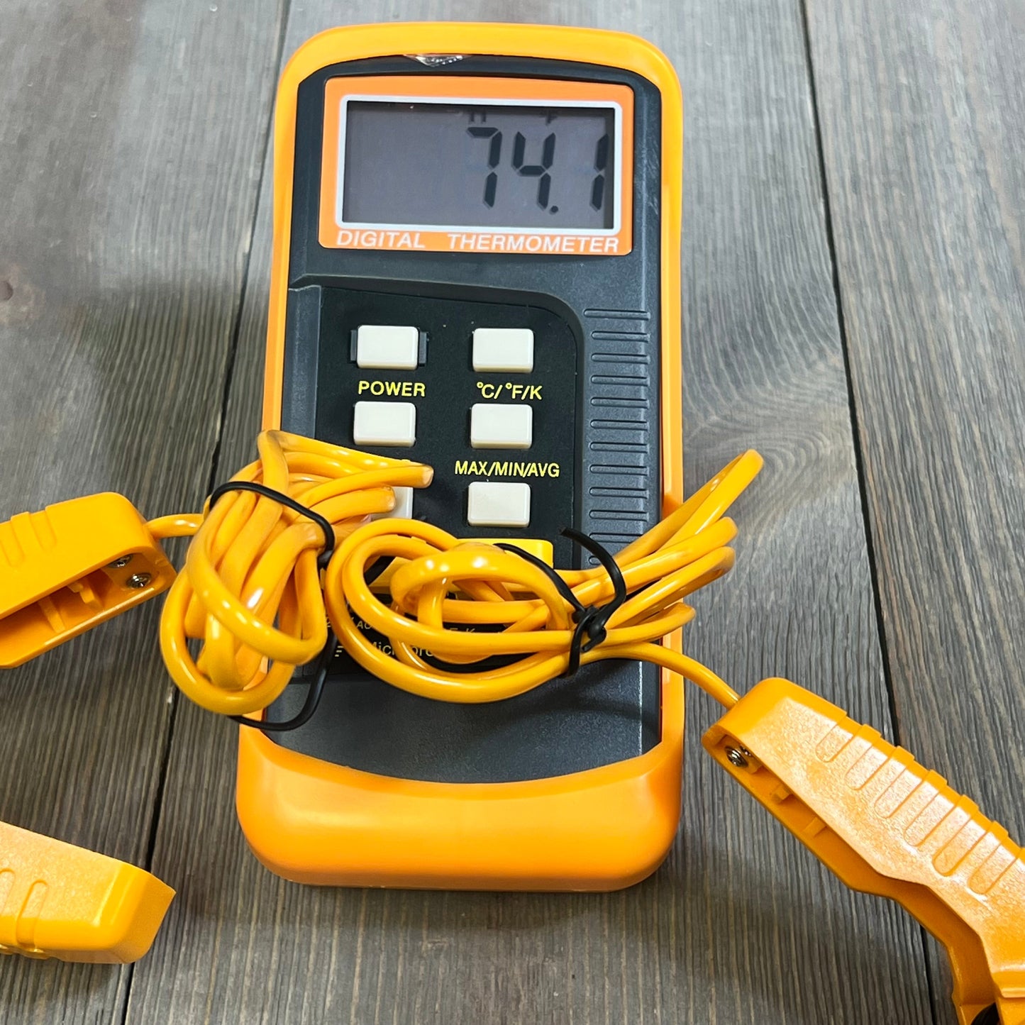 Digital K Type Thermocouple Thermometer with dual channels, temperature clamp, and probes, displaying 74.1°C on wooden table.