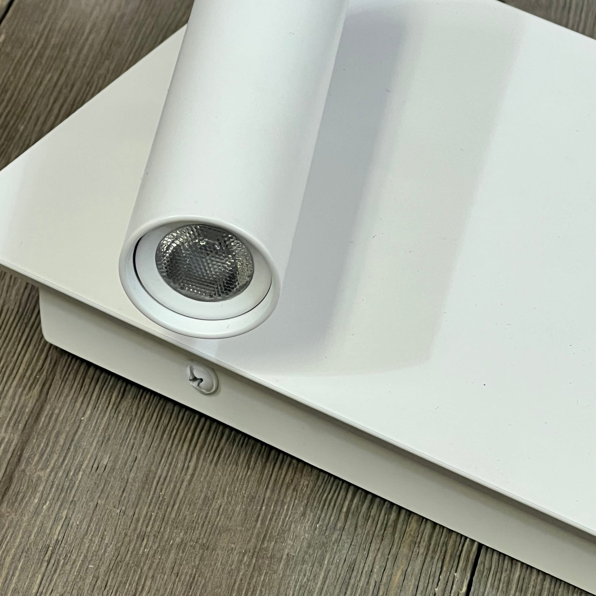 White wall-mounted reading light with dimmable LED and USB ports, perfect for bedroom ambiance and touch control convenience.