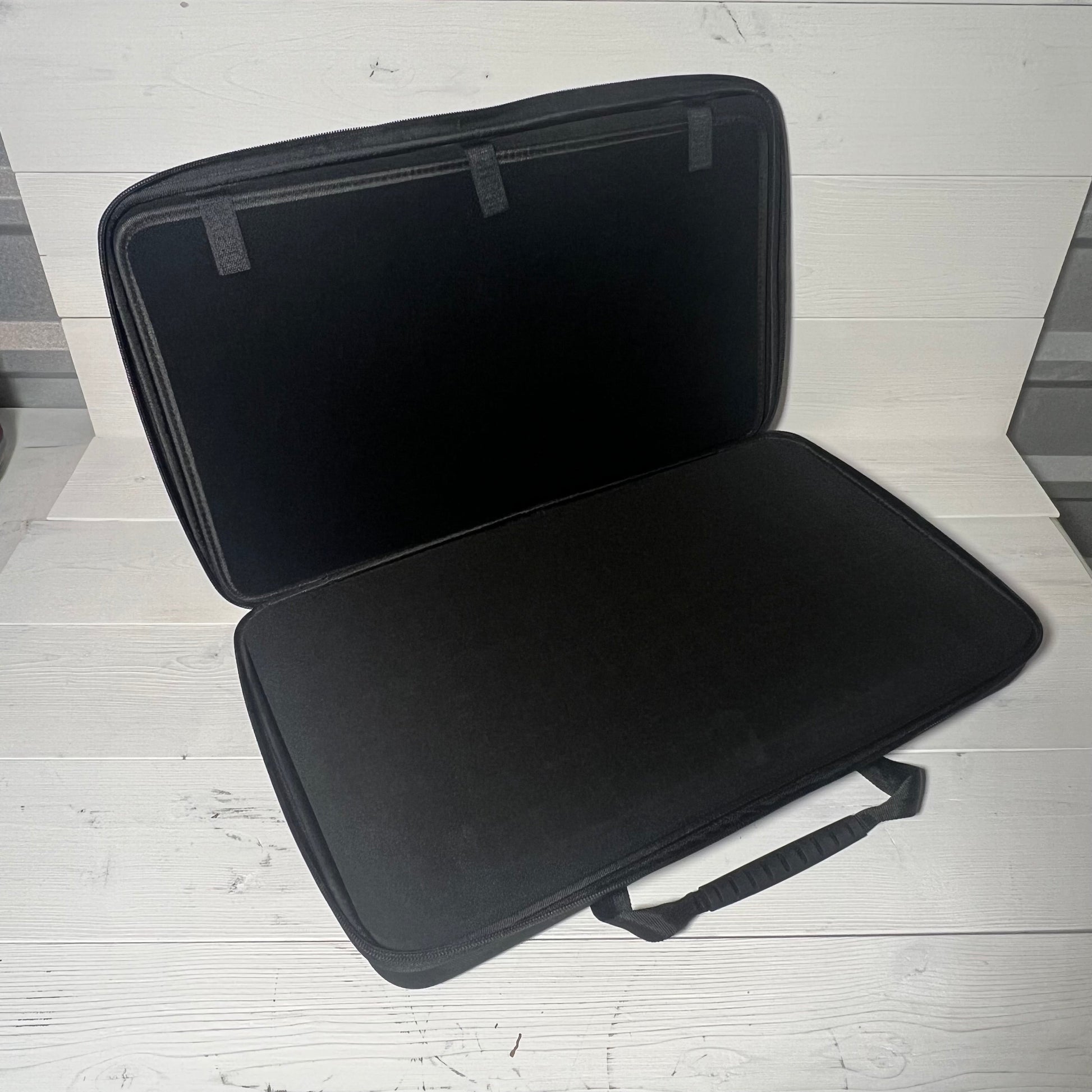 Open view of Brappo Miniature Storage Case with spacious interior and customizable foam for safe transport of figurines.