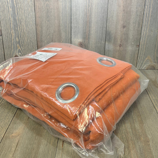 Burnt orange NICETOWN blackout curtains in packaging, featuring heavy-duty fabric and silver grommets for bedroom privacy.