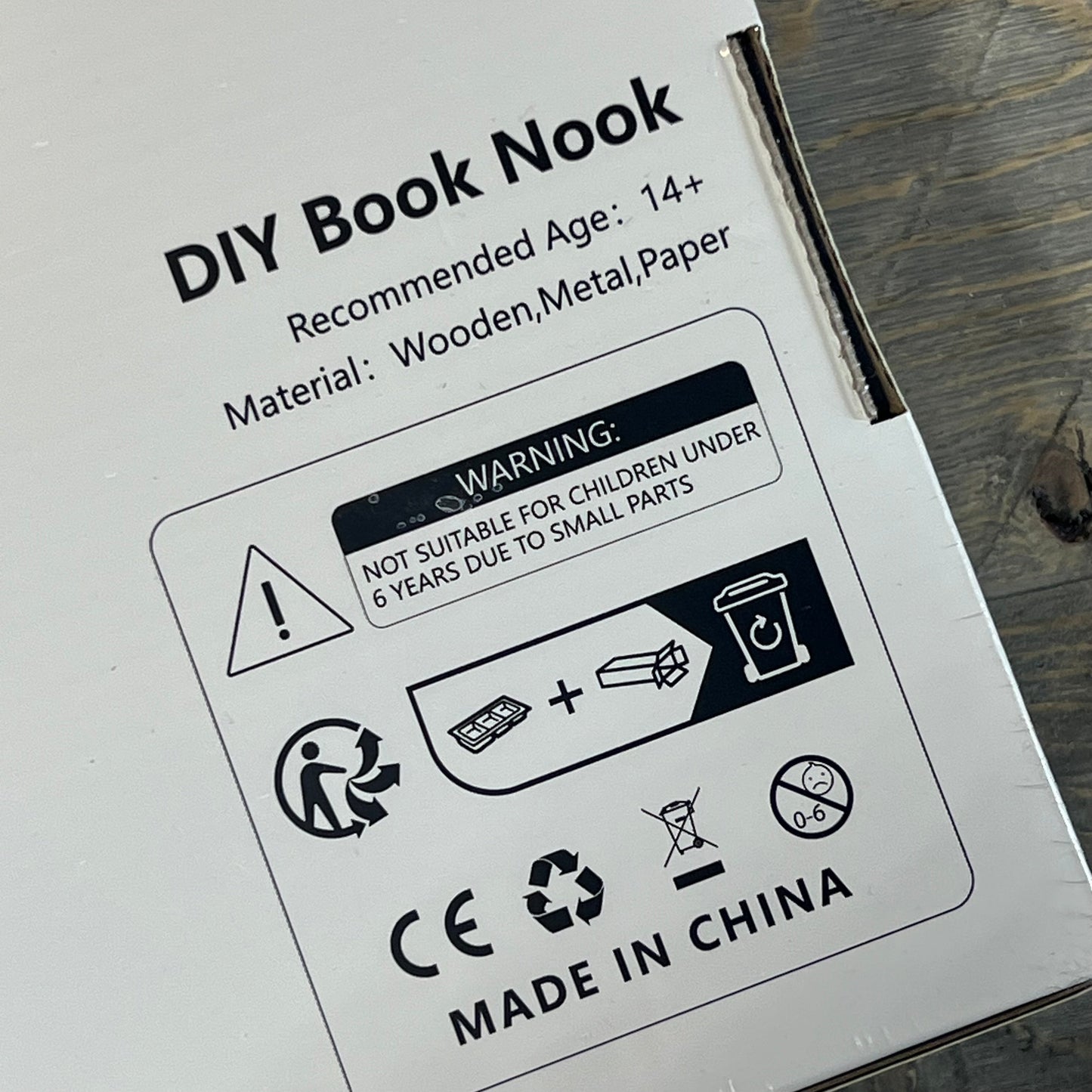Packaging for 1058206412-NEWREACH Book Nook Kit showing material details and safety warnings.