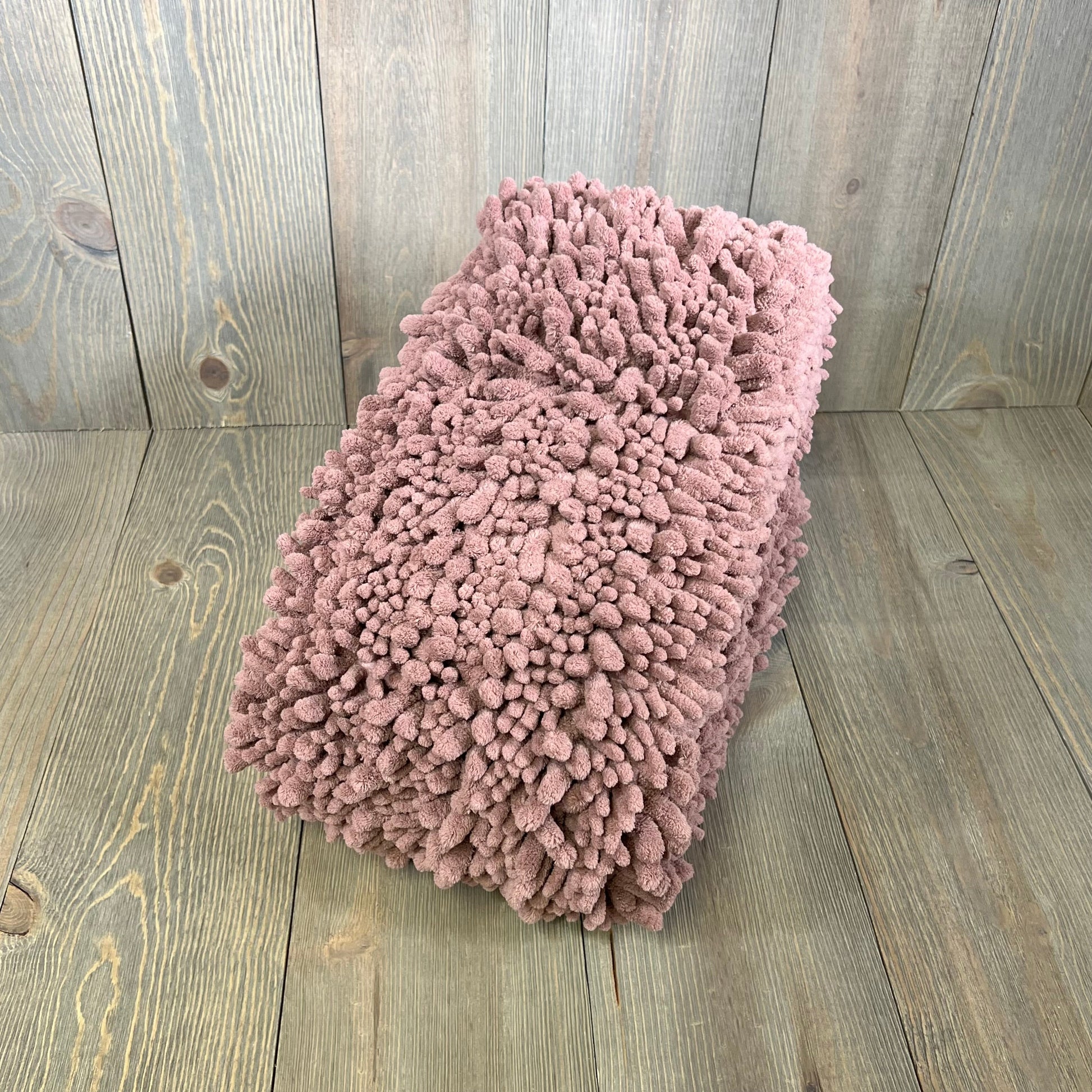 Mauve Yimobra bathroom rug, 44x24 inches, plush and thick, on wooden floor for modern home decor.