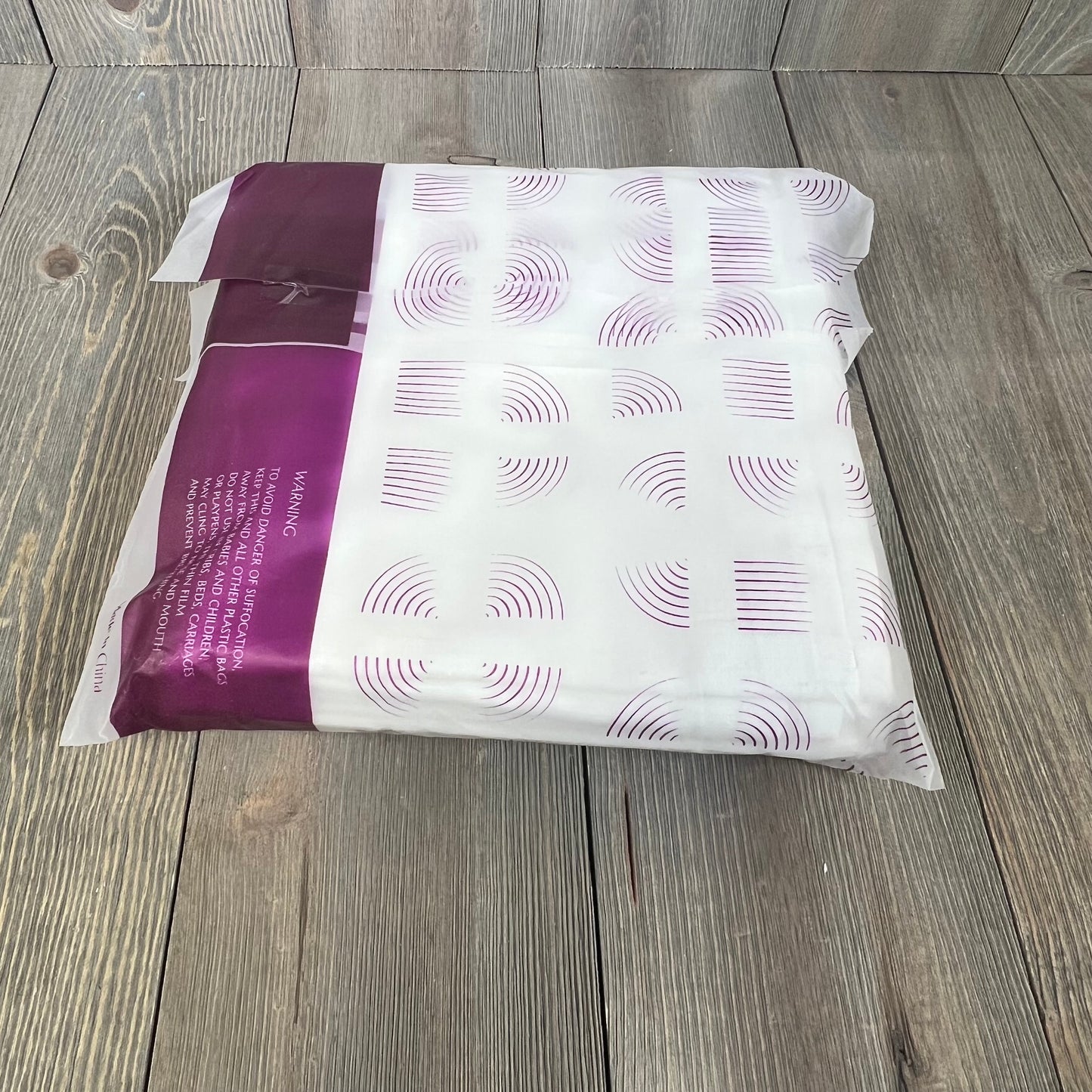 White linen blend curtains in packaging, 84 inches long, ideal for farmhouse decor, featuring light filtering and rod pocket design.