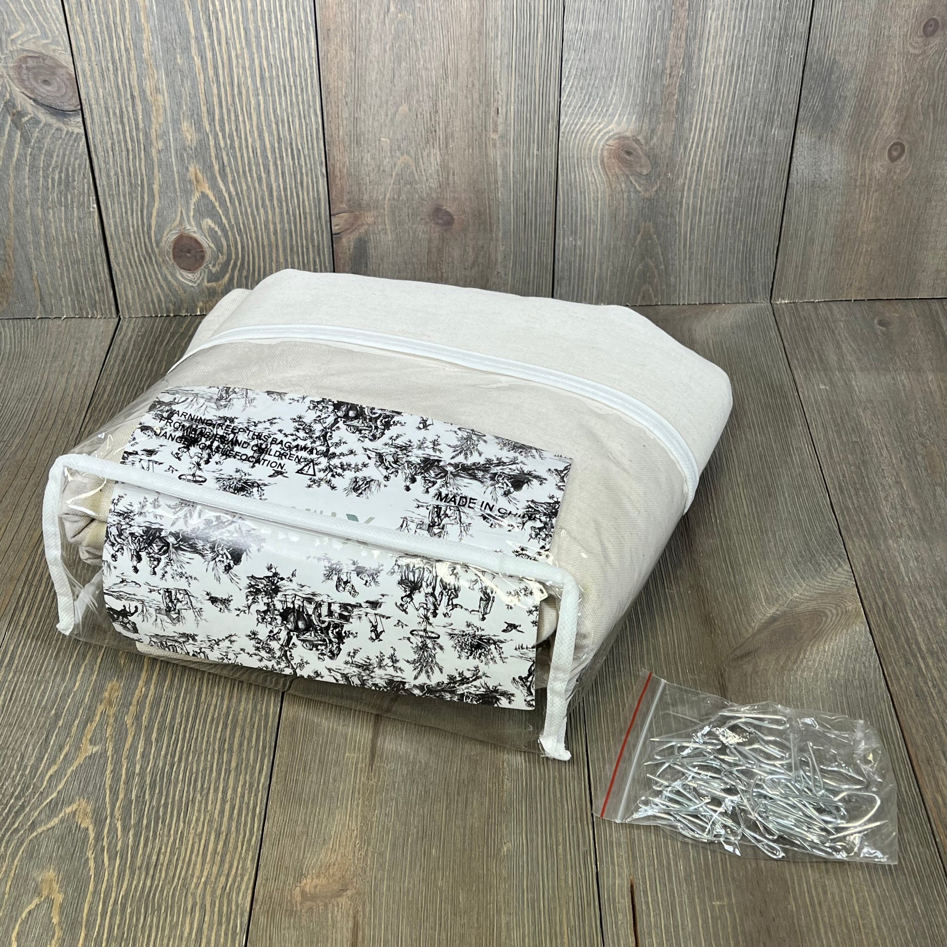 Cream linen drapes in packaging with hooks, 94-inch length, perfect for living room or bedroom decor.