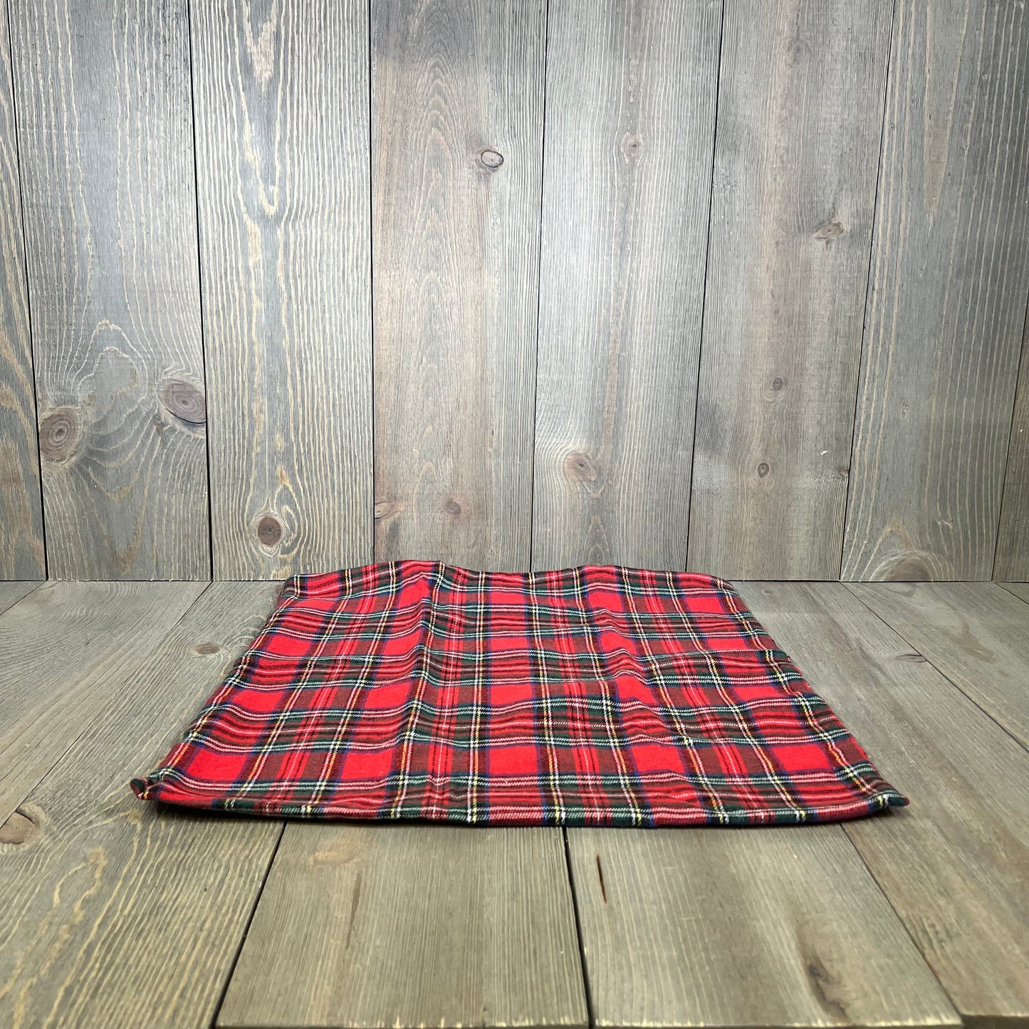 Red Scottish tartan plaid throw pillow cover on wooden floor, perfect for Christmas farmhouse decor, 16x16 inches.