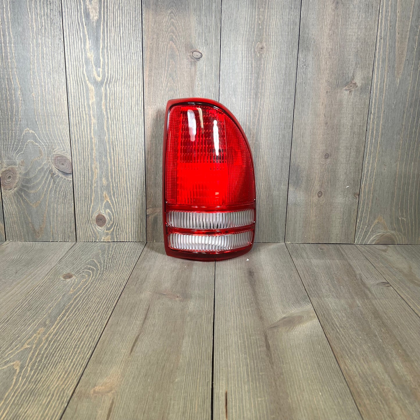 TYC right tail light assembly for 1997-2004 Dodge Dakota, featuring durable red and clear lens design.