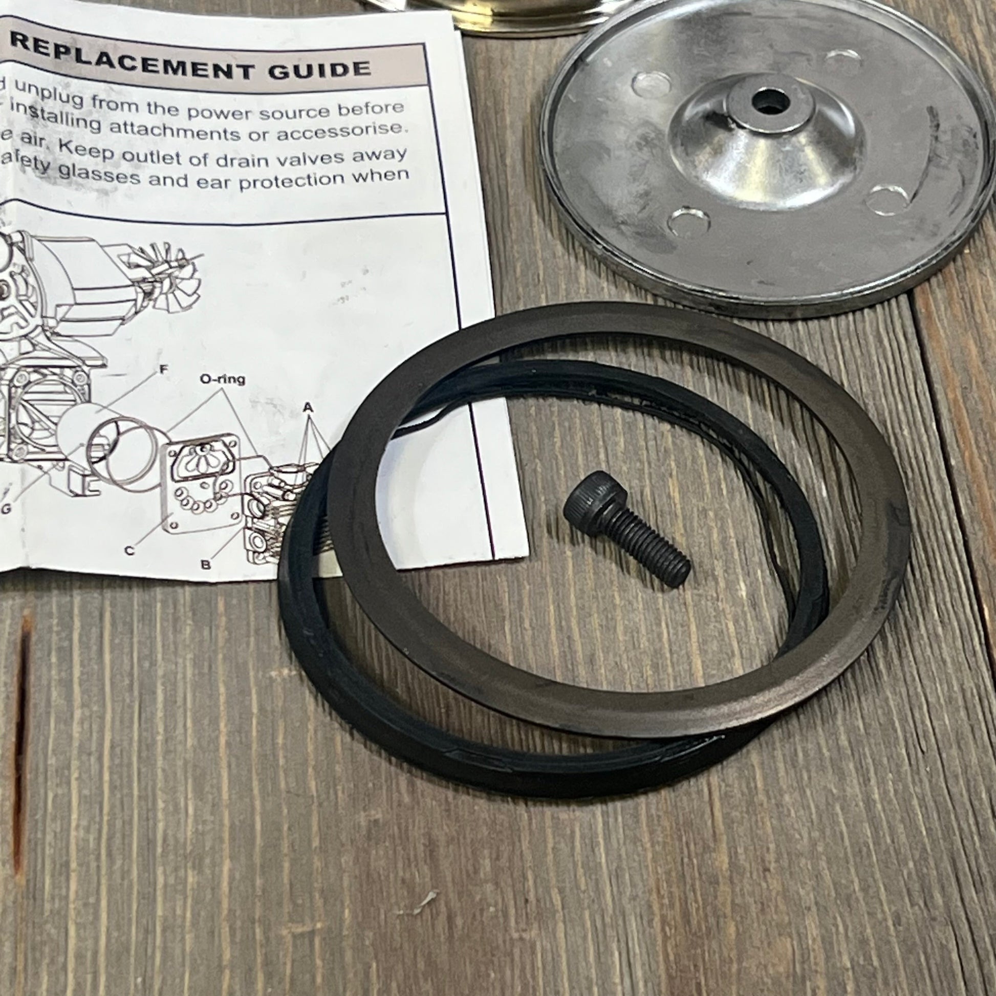 Air compressor piston rod parts with O-ring and screw, compatible with 73 mm bore cylinders, shown with replacement guide.