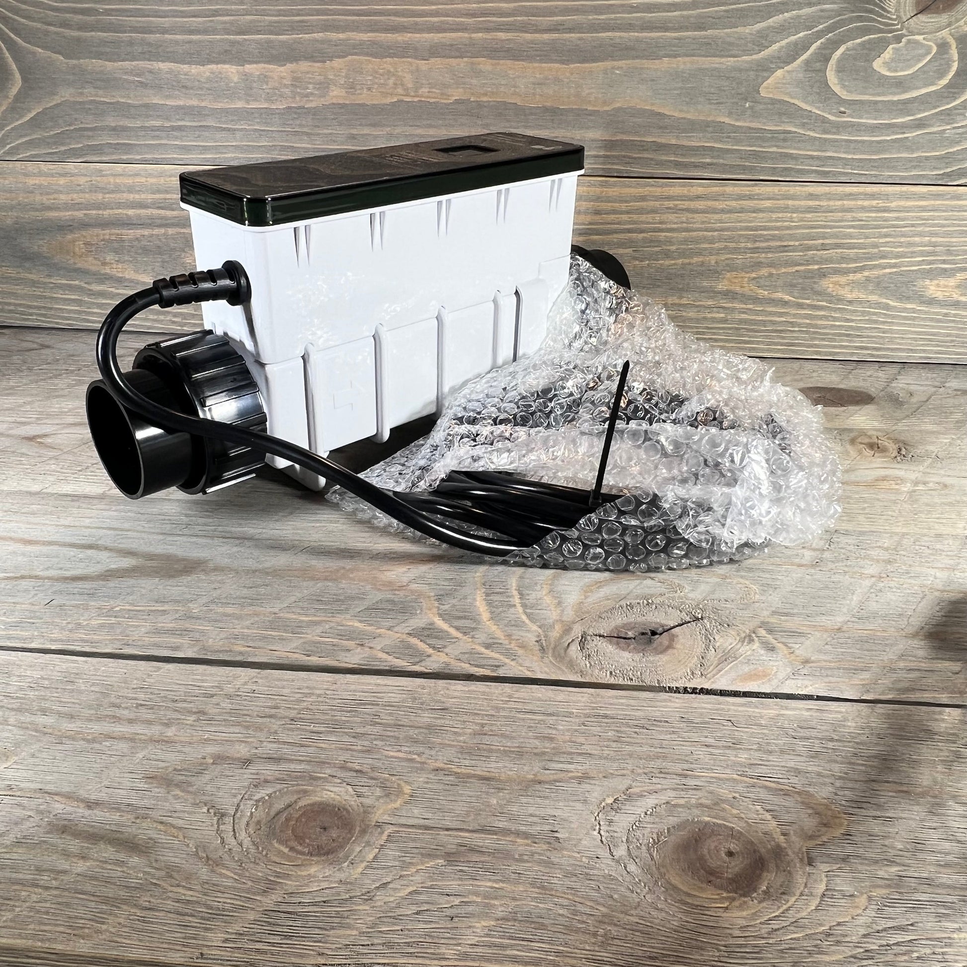 Replacement salt cell for Pentair Intellichlor IC 15, shown with packaging on wooden surface.