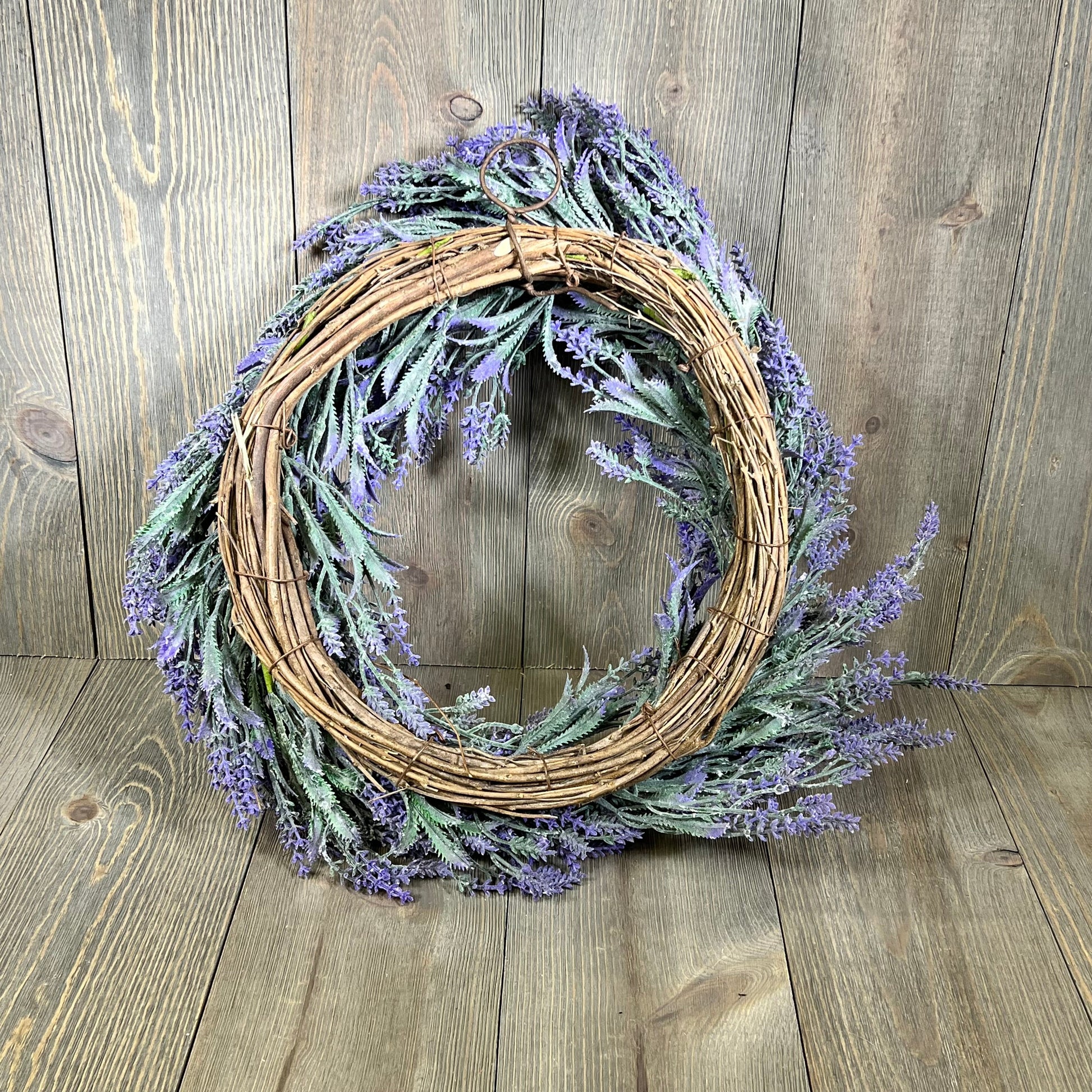 Rustic 20" lavender wreath with purple blooms and green foliage, perfect for spring and summer front door decor.