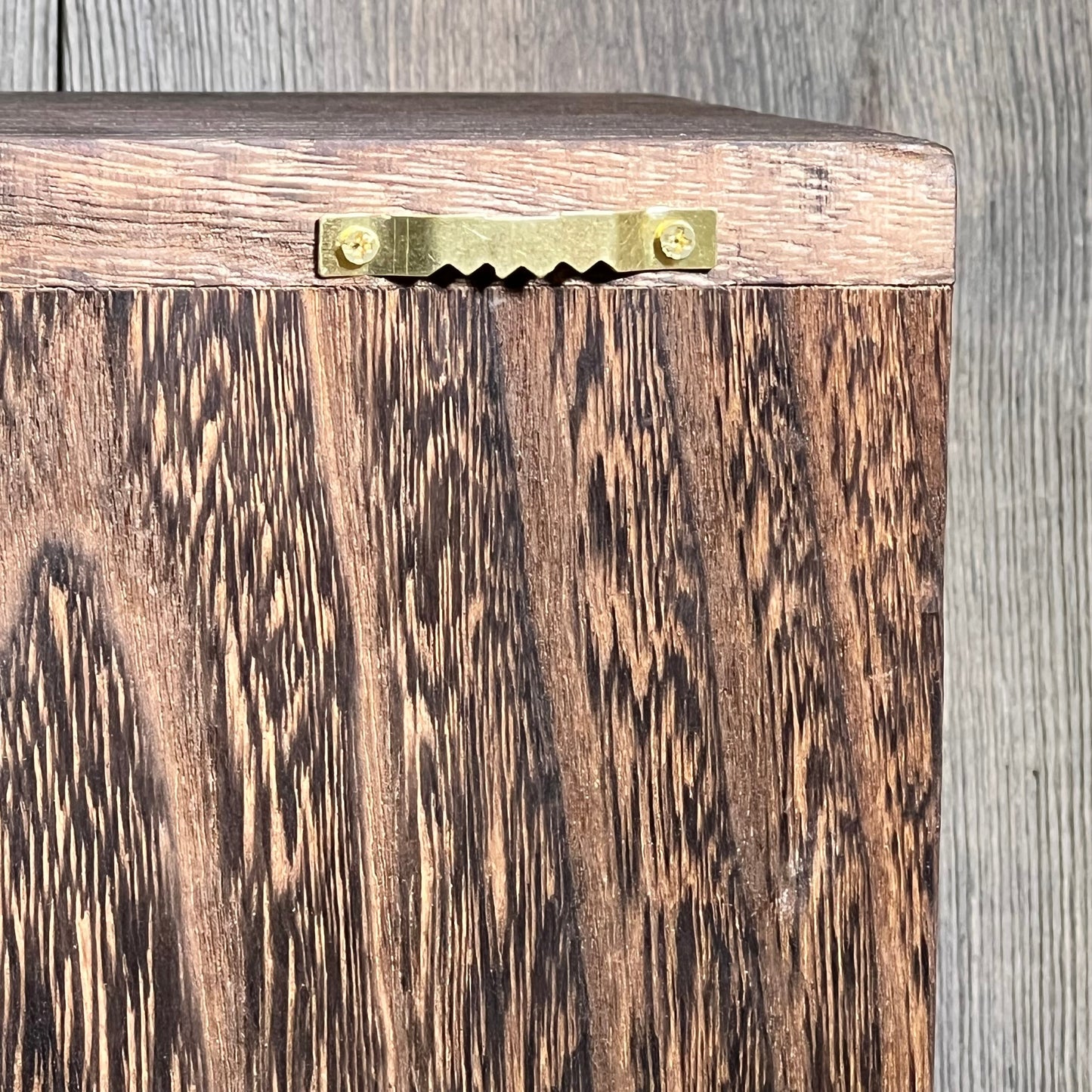Close-up of rustic wooden texture on GLANT barn door jewelry organizer, showcasing its sturdy wall mount design.