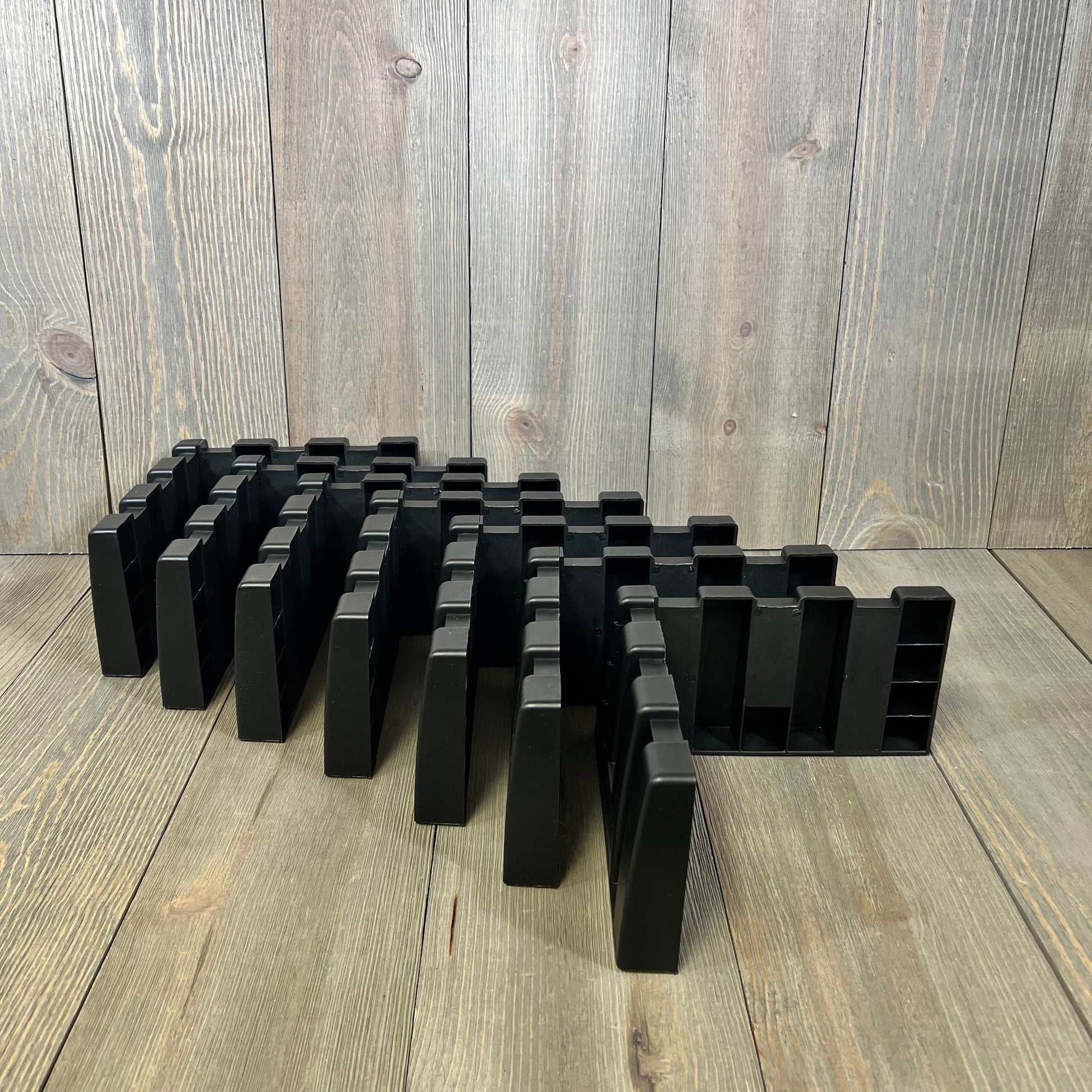 Durable car trunk organizer blocks in black, ideal for SUV storage. Perfect for organizing cargo on wool carpets.