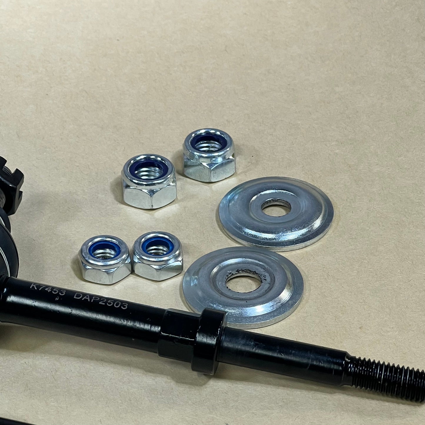 Sway bar links with nuts and washers for Dodge Ram 1500, 2500, 3500, 4WD, K7453, 1046010420-DEARMMGG, close-up view.