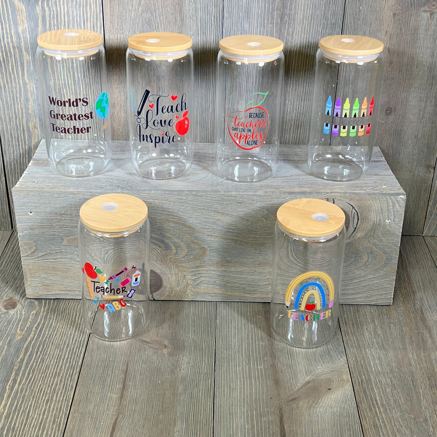 Teacher appreciation glass cups set with colorful designs, bamboo lids, and straws, perfect for gifts, 16 oz size.
Wooden lidded teacher gift cups featuring vibrant educational themes, ideal for Teachers Week, includes cleaning brush.
Maxcheck 6-set glass teacher cups with inspiring motifs, complete with lids and eco-friendly straws for appreciation gifts.
Vividly decorated teacher cups with bamboo lids, perfect for expressing gratitude during Teachers Week, 16 oz capacity.
Teacher-themed glass cup set,