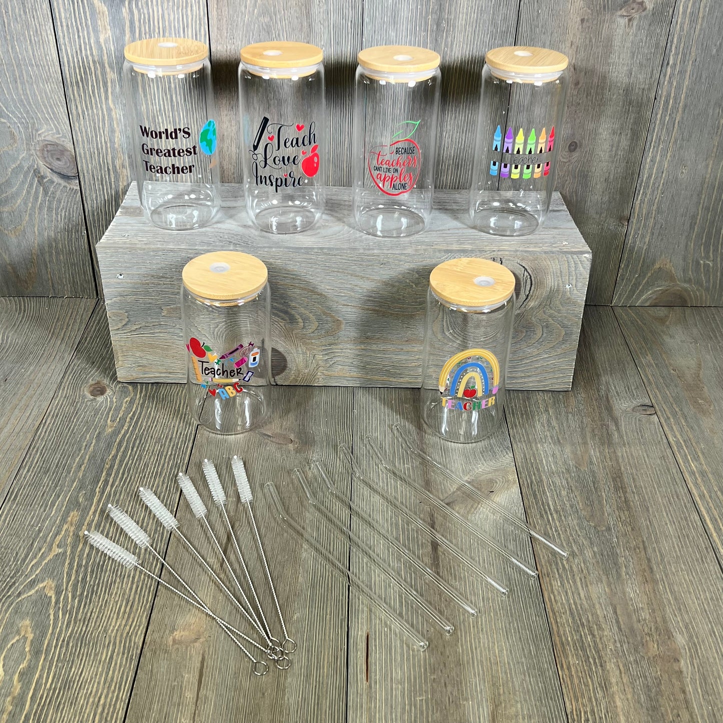 Teacher appreciation gift set with six 16 oz glass cups, lids, straws, and cleaning brushes, perfect for Teacher's Week.