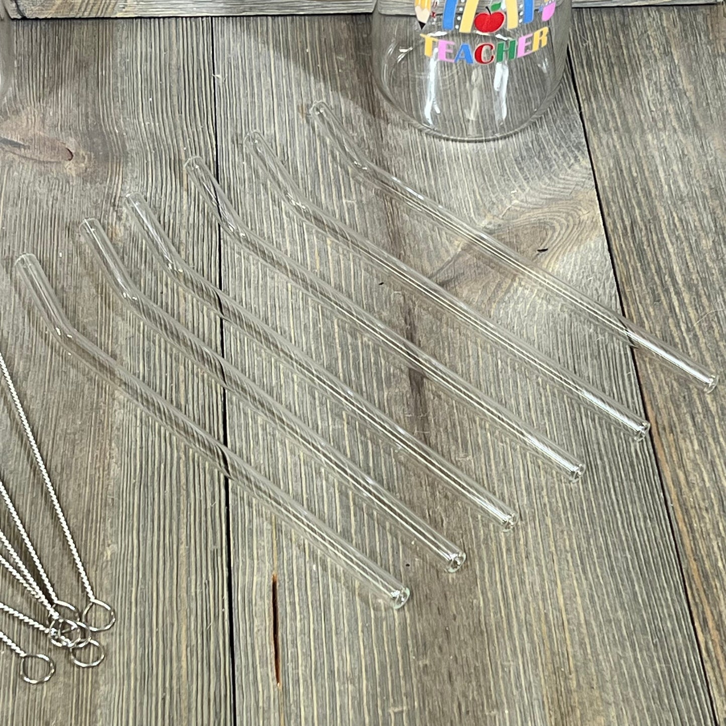 Glass straws and cup with colorful teacher design, part of Maxcheck 6 Sets Teacher Appreciation Gifts, 16 oz capacity.