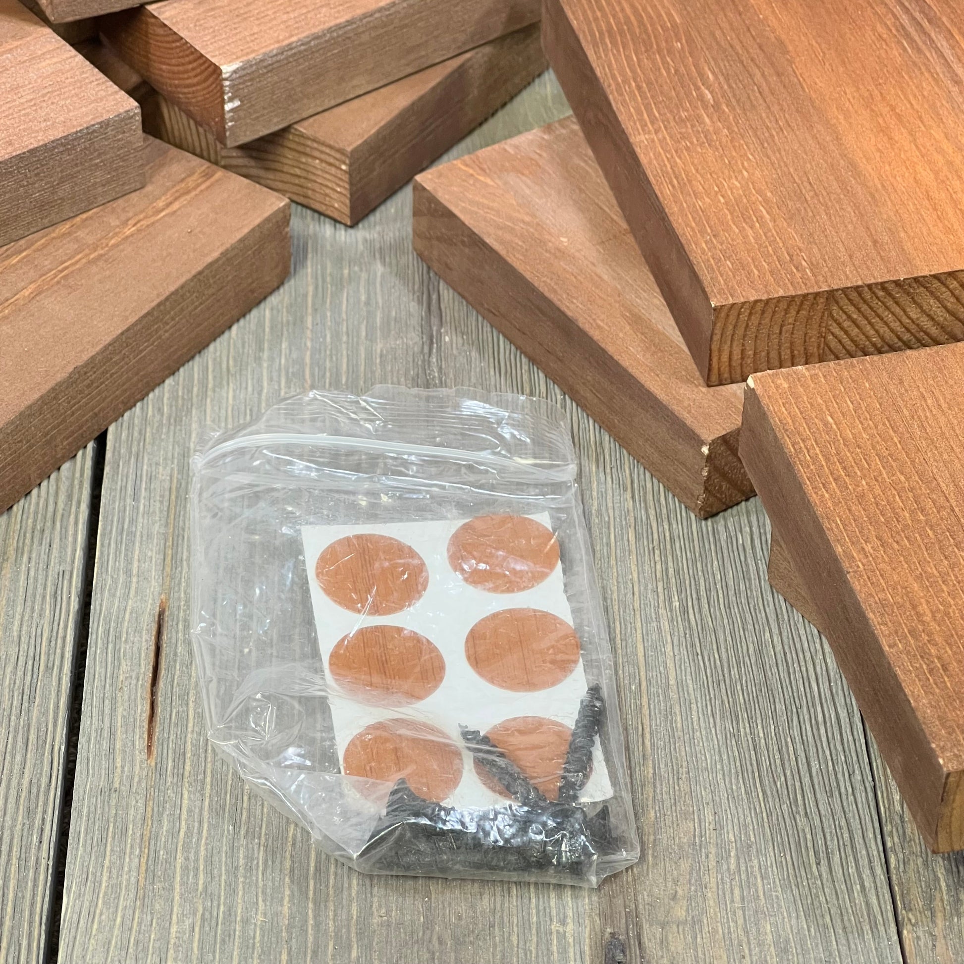 Wood pieces and small parts for WELLAND rustic wood countertop wine rack assembly, showcasing natural finish and minimal assembly.